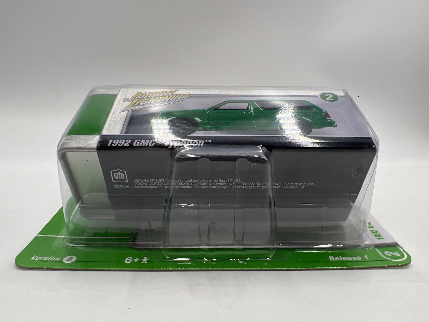 2025 Johnny Lightning Pro Collector Series Release 1 Version B 1992 GMC Typhoon Green W/Storage Tin