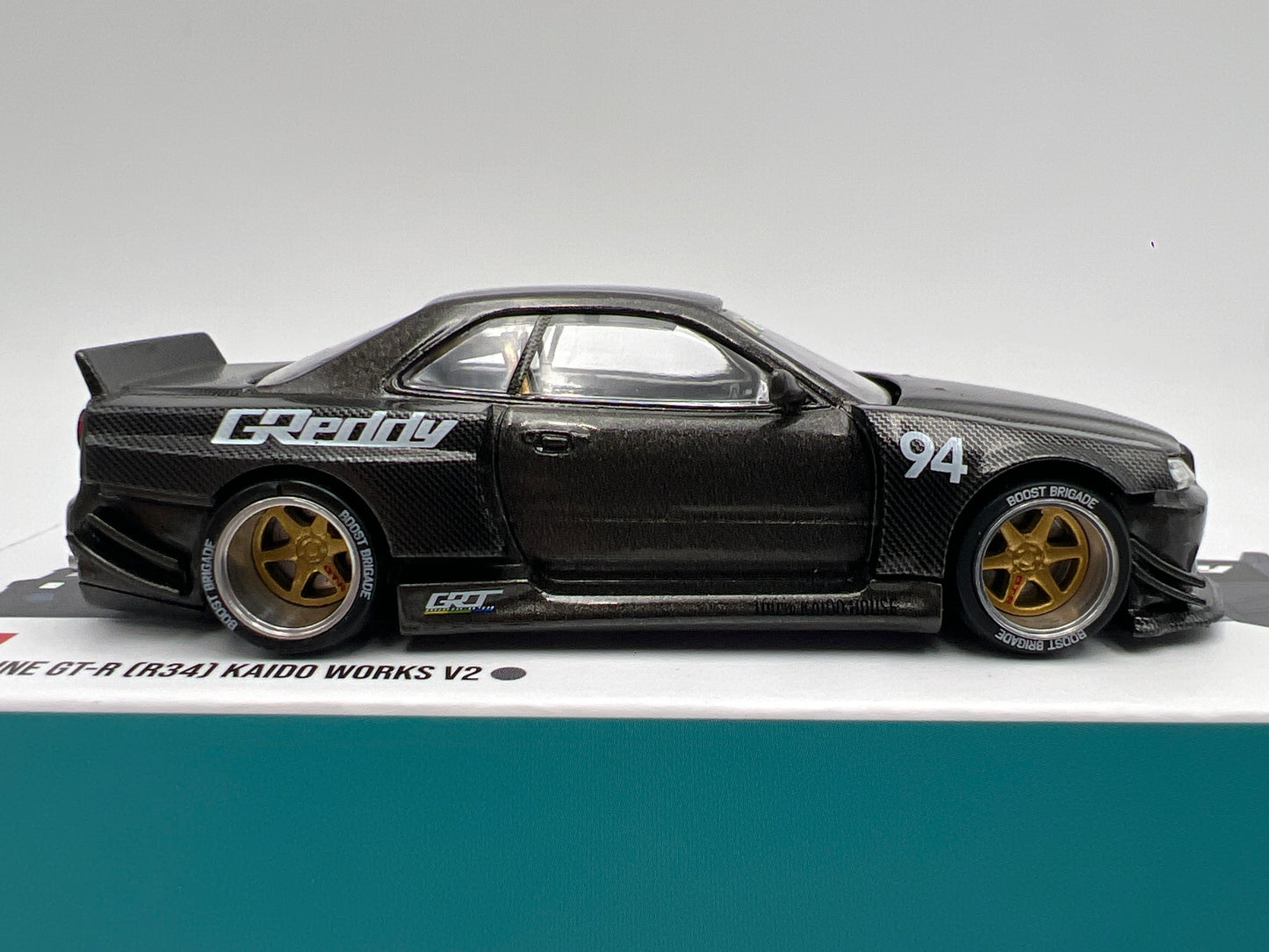 Mini GT Kaido House #222 Nissan Skyline GT-R R34 Kaido Works Carbon V2 GReddy