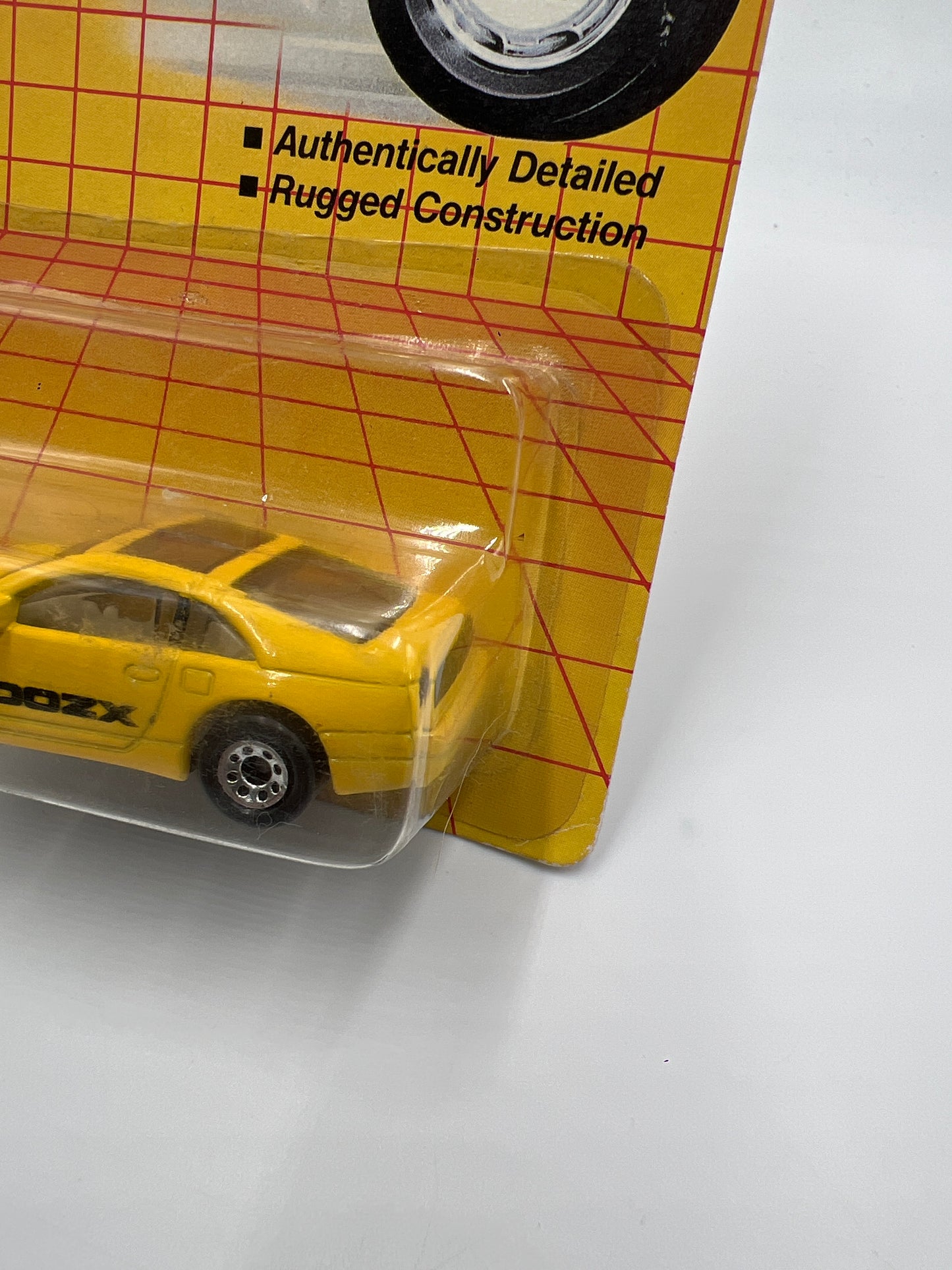 1990 Matchbox Motors MB #61 300ZX Yellow W/Protector Bad Card SR