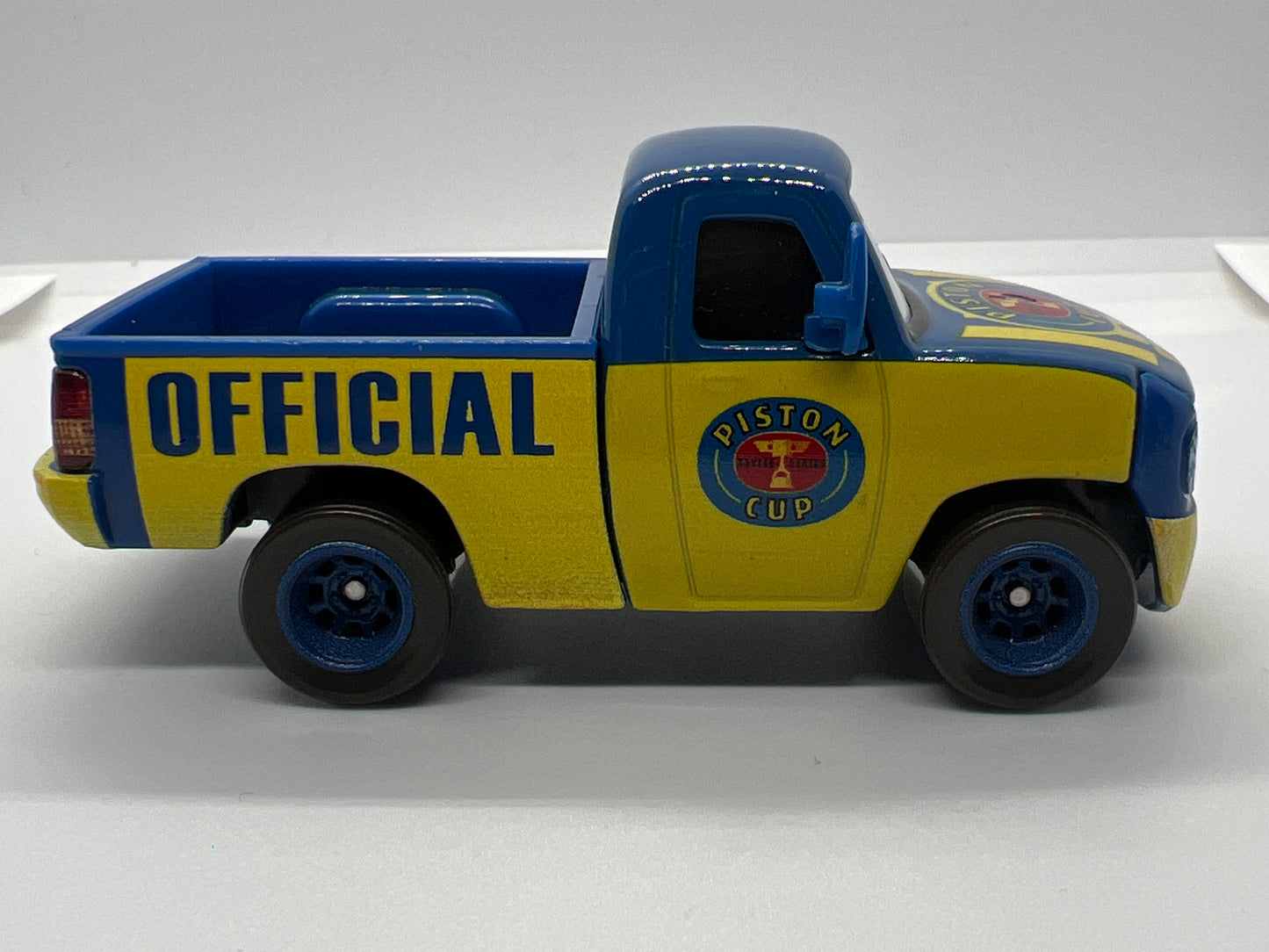 Disney Pixar Cars Piston Cup Race Tom Truck Blue/Yellow Loose