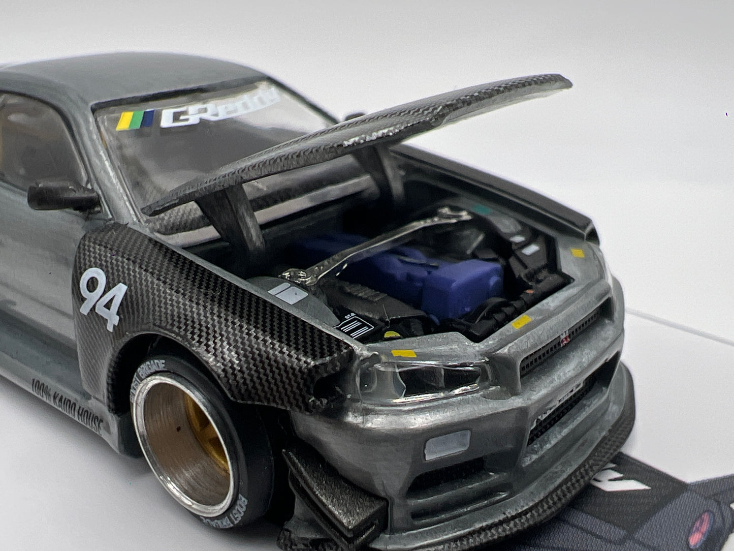 Mini GT Kaido House #222 CHASE Nissan Skyline GT-R R34 Kaido Works Carbon V2 GReddy