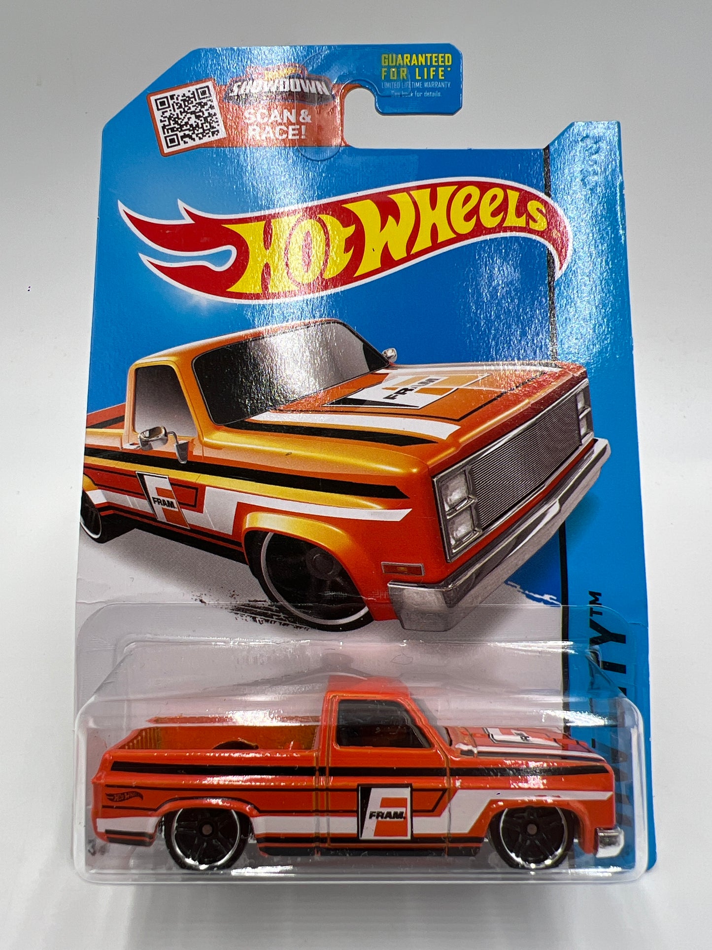 2015 Hot Wheels City #16 83 Chevy Silverado Fram Orange W/Protector Bad Card