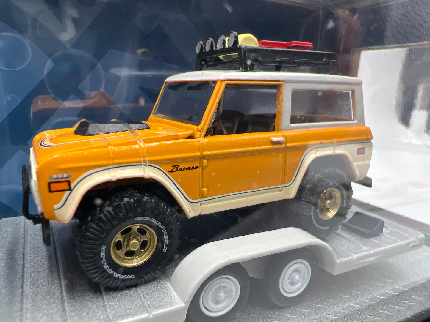 2025 M2 Machines Auto Haulers 1969 Ford F-100 Ranger Truck & 1971 Ford Bronco R85 Orange R85