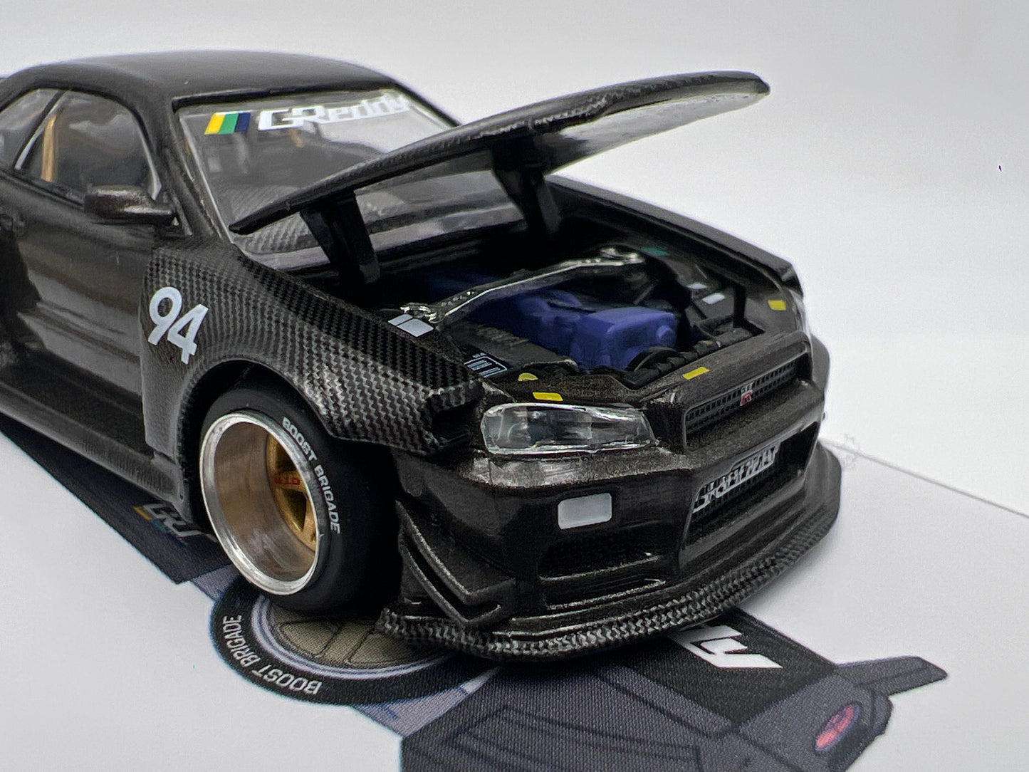 Mini GT Kaido House #222 Nissan Skyline GT-R R34 Kaido Works Carbon V2 GReddy