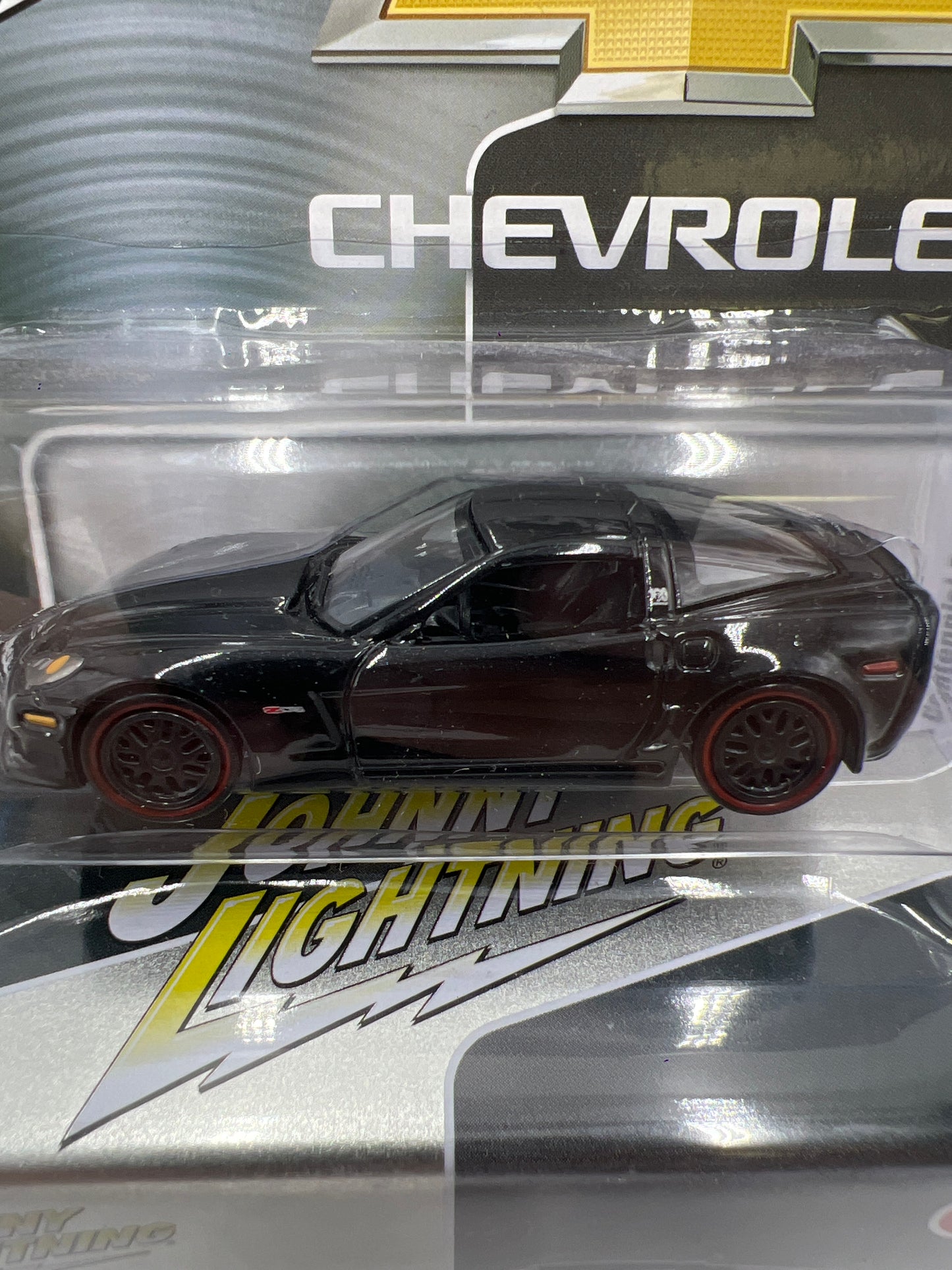 Johnny Lightning 2012 Chevy Corvette Z06 Centennial Edition Black W/Tin 217D