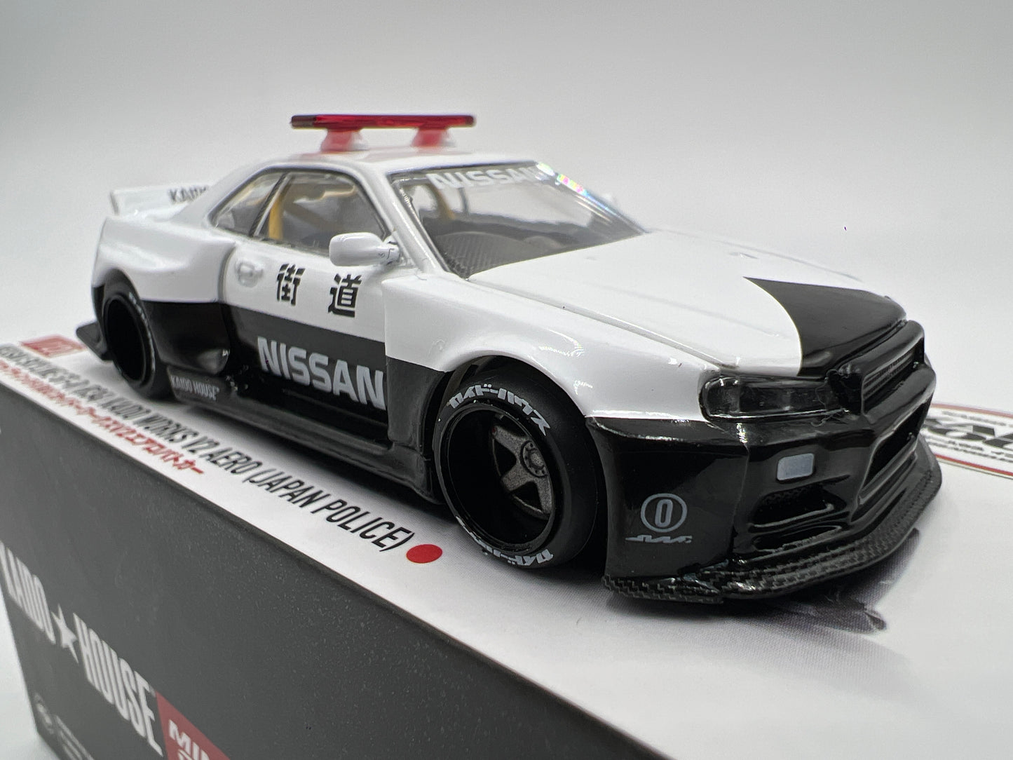 Mini GT x Kaido House #120 Nissan Skyline GT-R R34 Kaido Works V2 Aero Japan Police