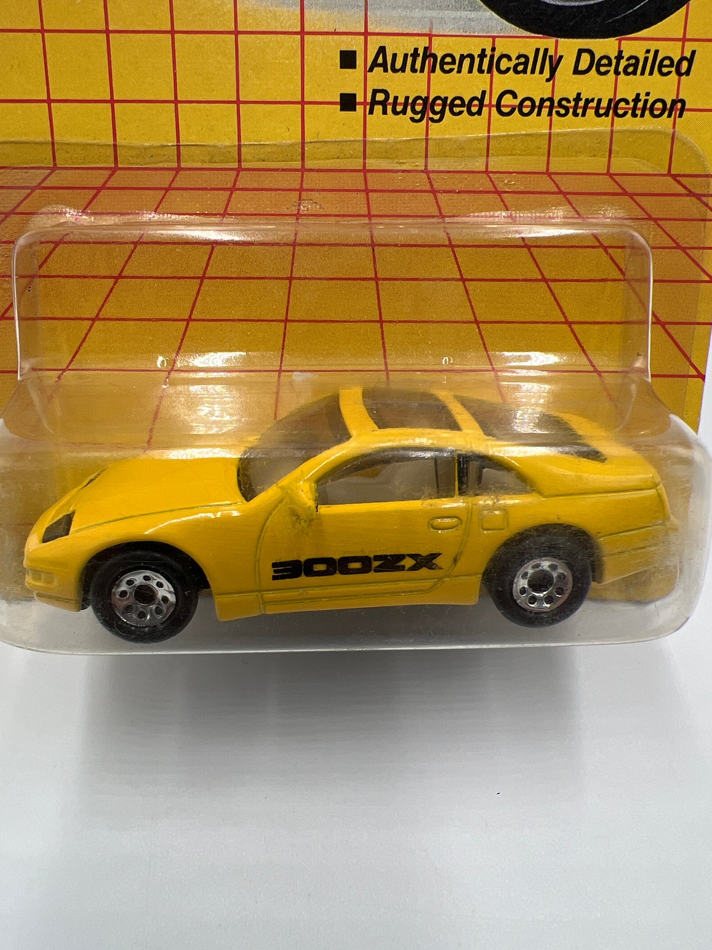 1990 Matchbox Motors MB #61 300ZX Yellow W/Protector Bad Card SR