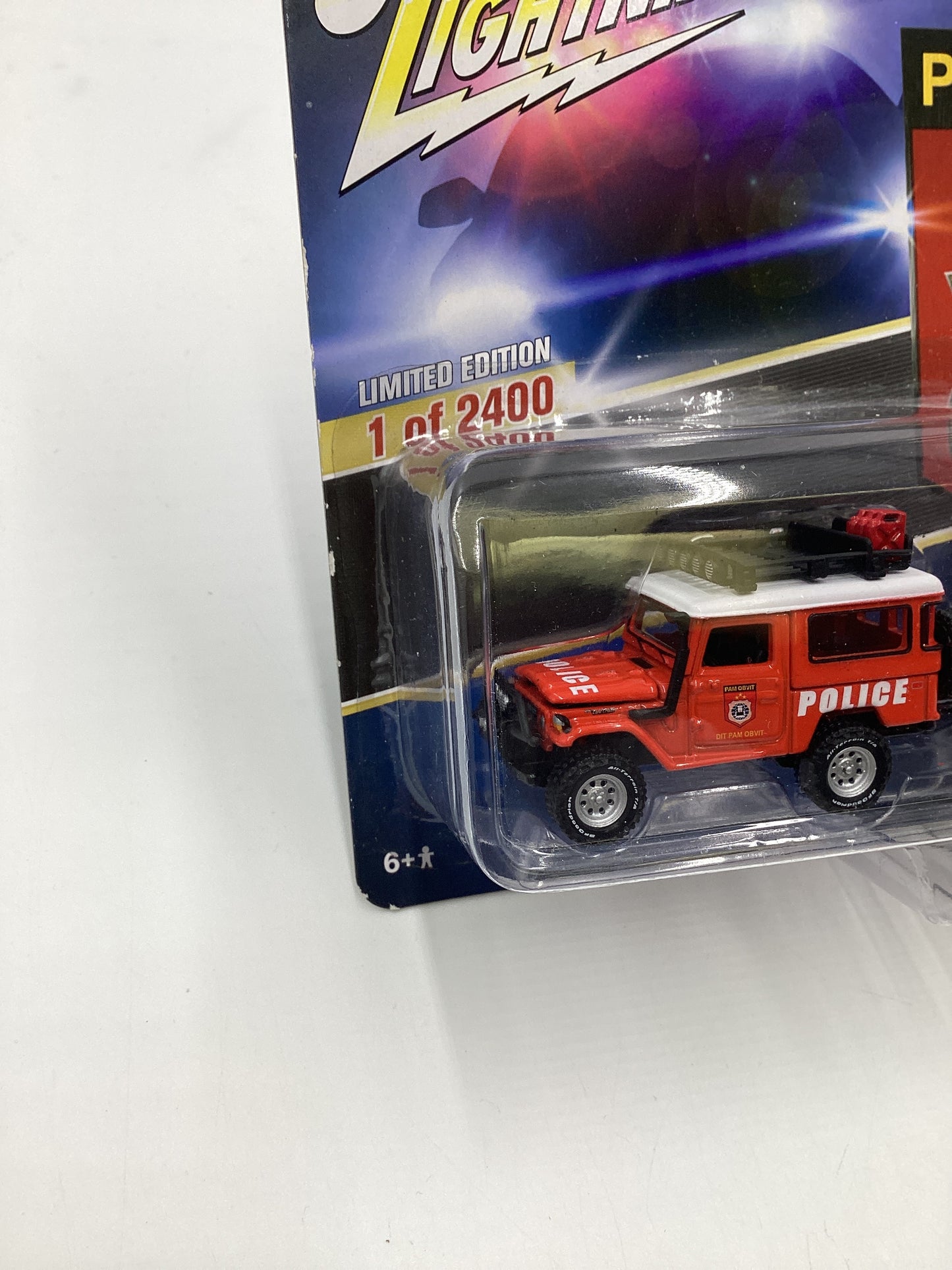 Johnny Lightning Bishop Exclusive Pam Obvit 1980 Toyota Land Cruiser w/ Boat & Trailer