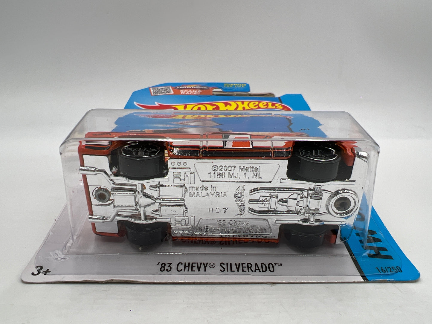 2015 Hot Wheels City #16 83 Chevy Silverado Fram Orange W/Protector Bad Card