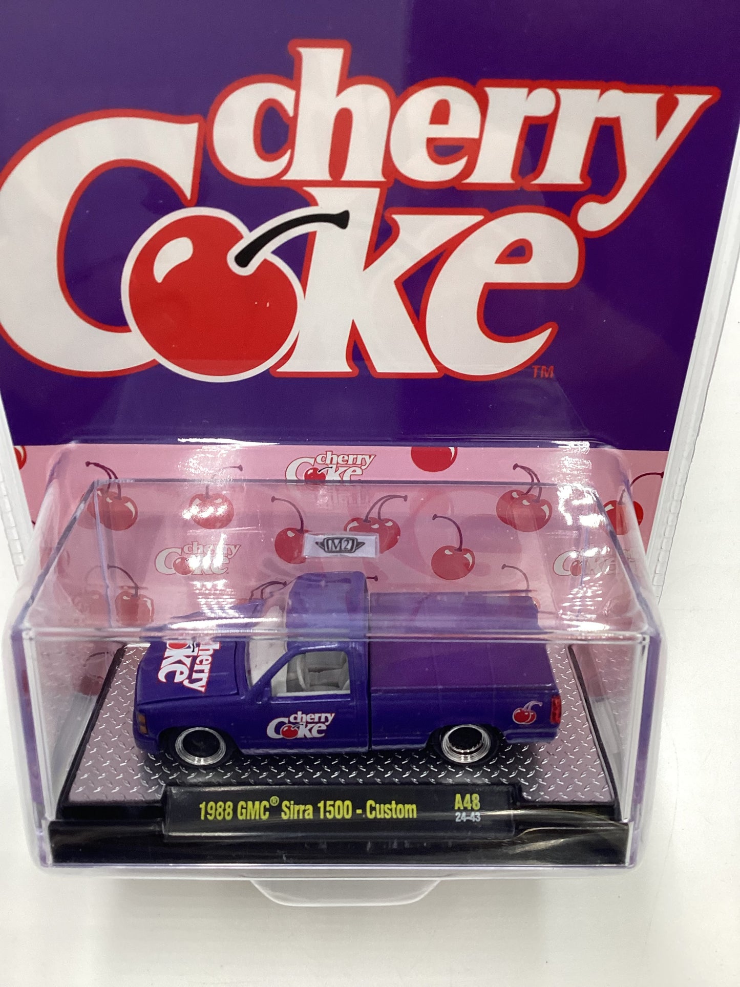 2024 M2 Machines Cherry Coke (Sirra Error) 1988 GMC Sierra 1500 Custom Purple 205E