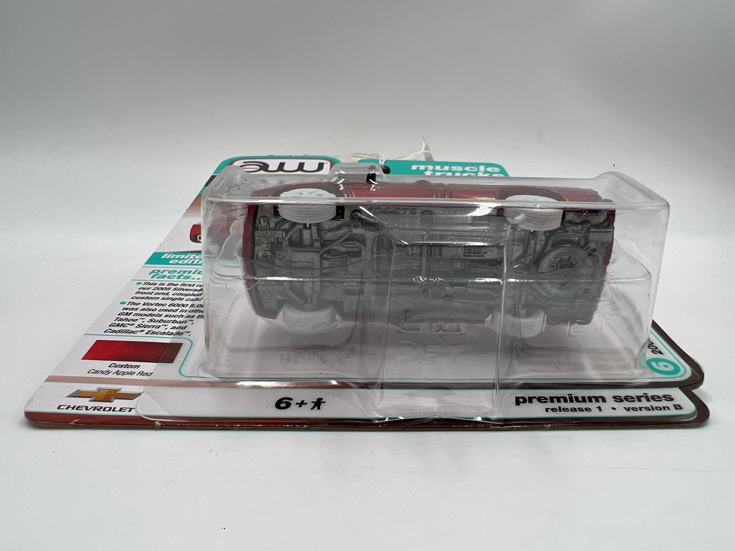 2025 Auto World Muscle Trucks CHASE Release 1 Version B 2005 Chevy Silverado SS Custom Ultra Red Cateye