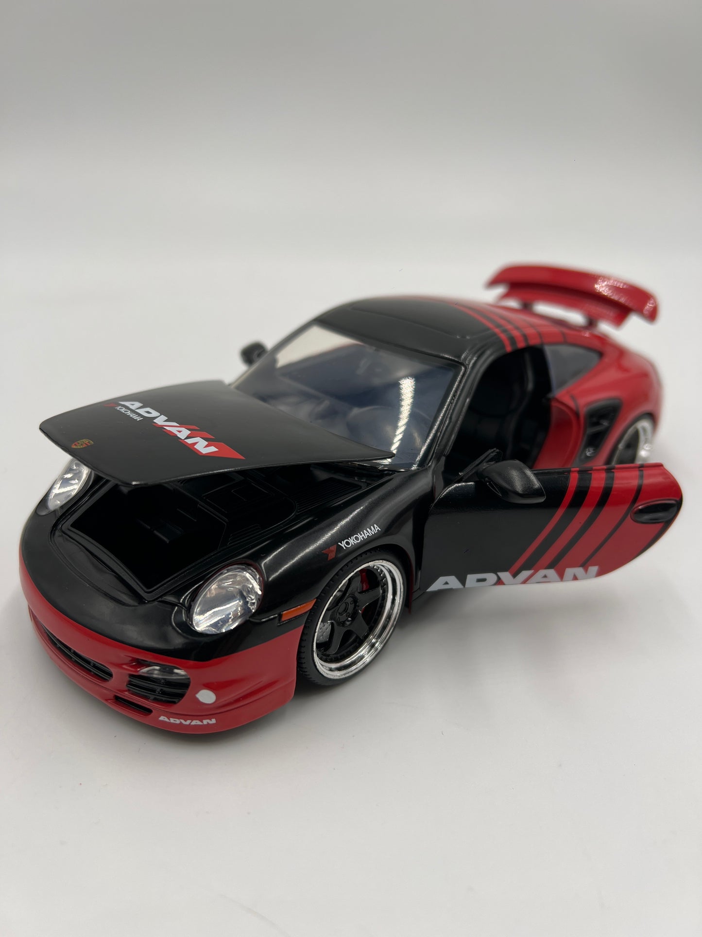 Jada Toys 1/24 Scale Advan 2007 Porsche 911 Turbo Black/Red Loose