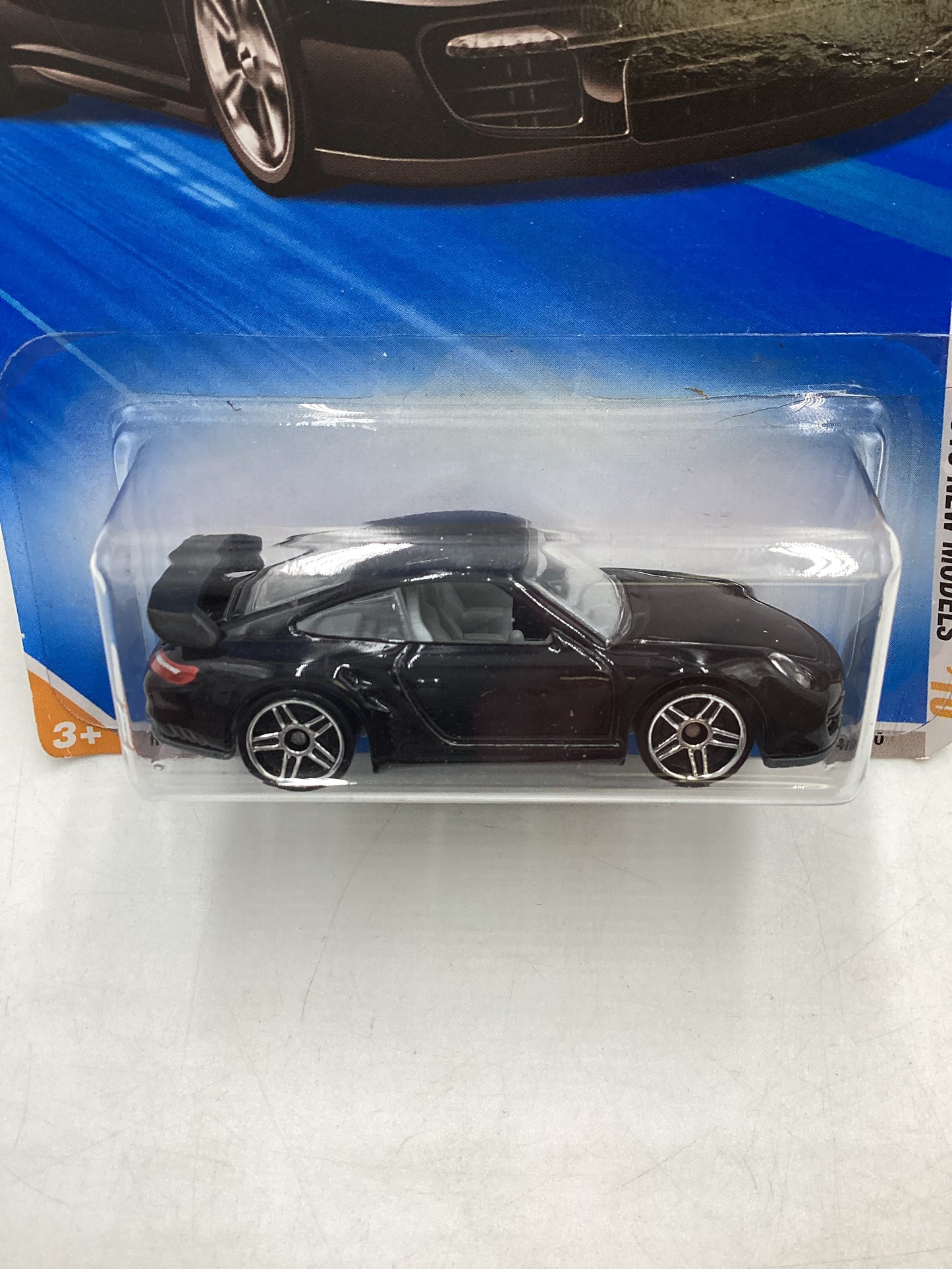 2010 Hot Wheels #014 Black Porsche 911 GT2 *Creased Card*