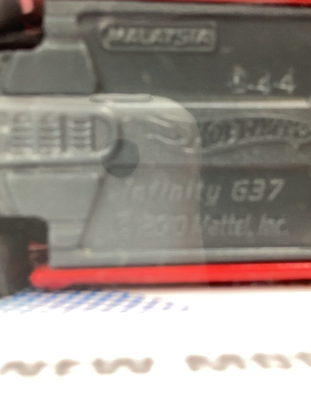 2010 Hot Wheels #32 10 Infiniti G37 red name spelled wrong on base with protector