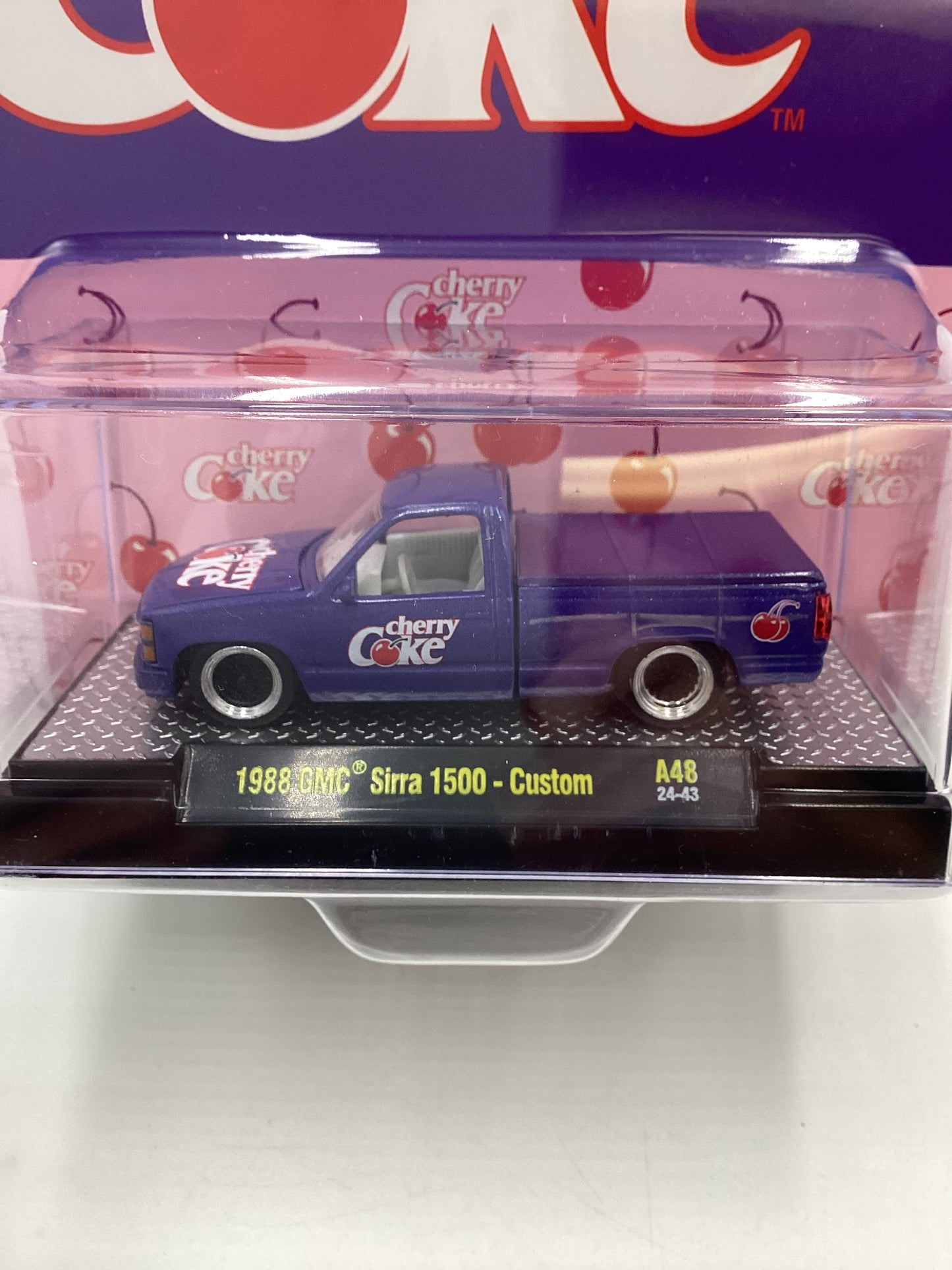 2024 M2 Machines Cherry Coke (Sirra Error) 1988 GMC Sierra 1500 Custom Purple 205E