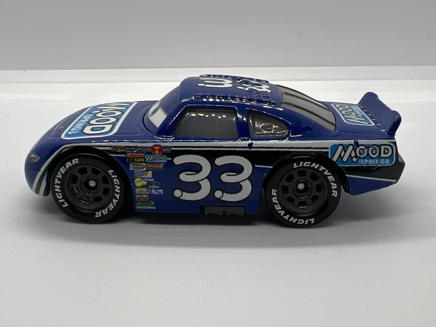 Disney Pixar Cars Dinoco 400 #33 Dud Throttleman Mood Springs Blue Loose