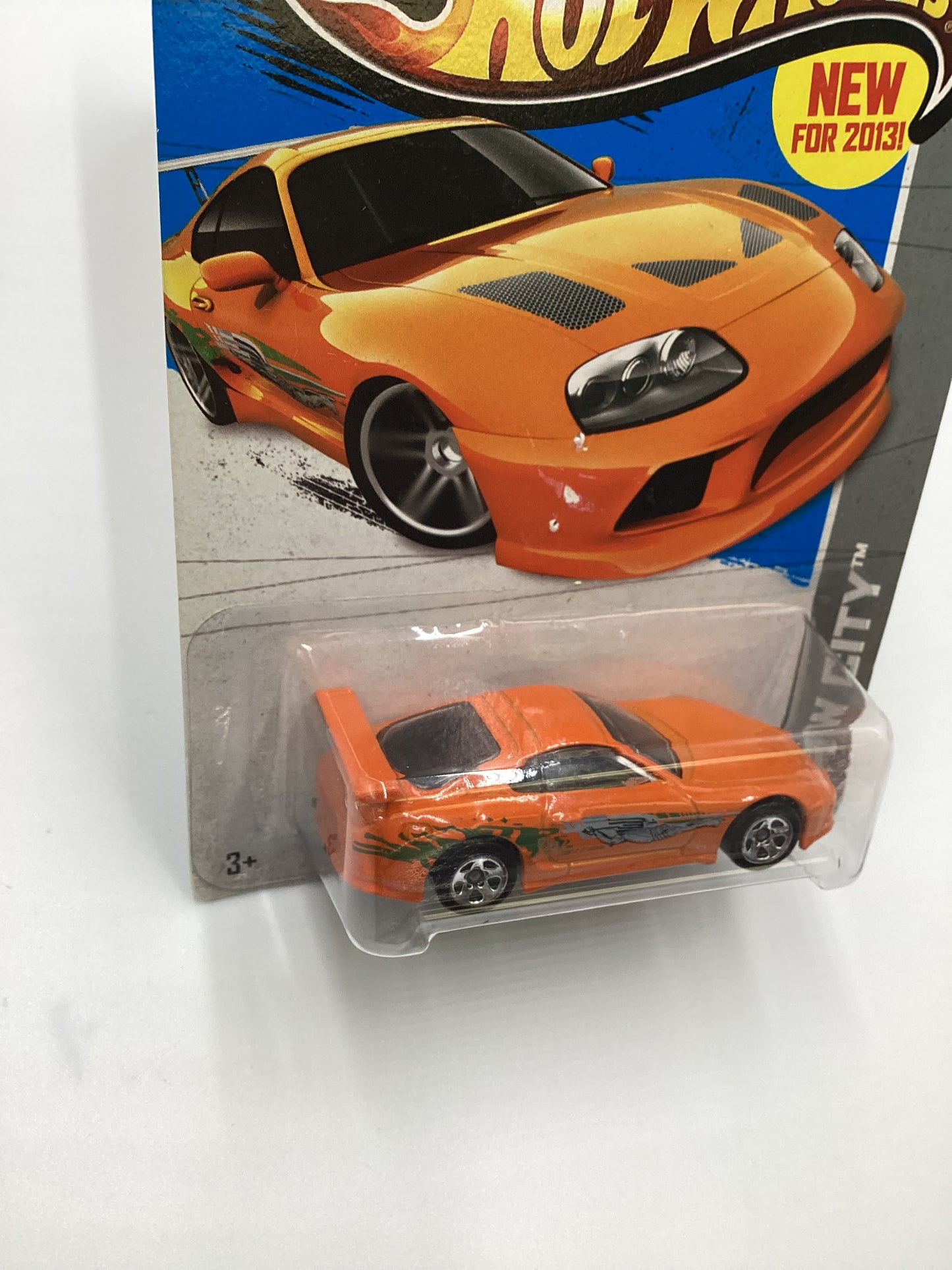 2013 Hot Wheels Fast and furious #5 Toyota Supra Orange with protector Card not perfect