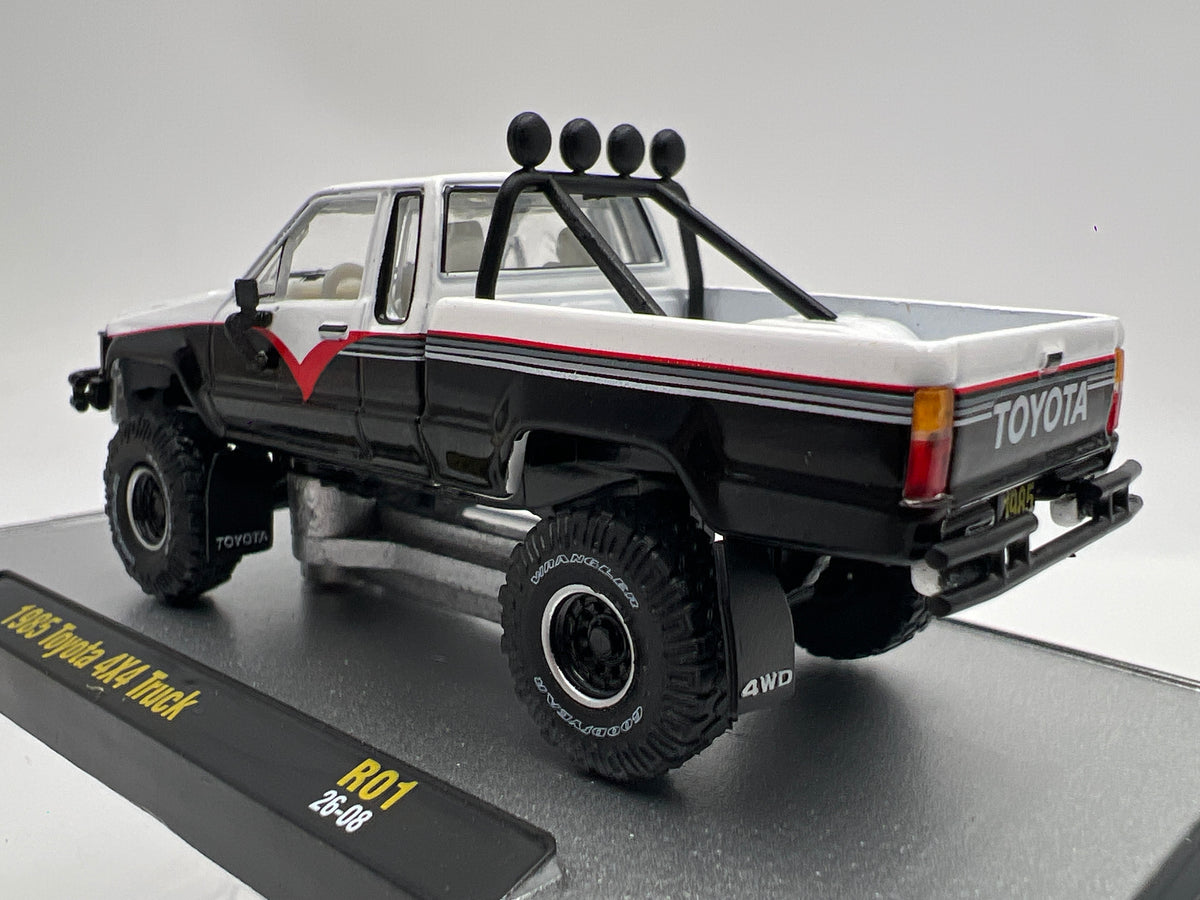 2026 M2 Machines R01 Blind Box 1985 Toyota 4x4 Truck Black/White