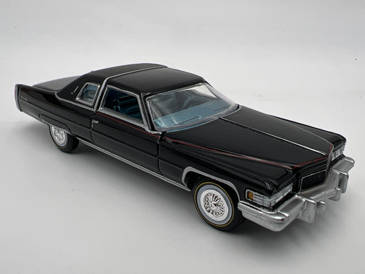 Auto World 1/64 Land Yachts 1976 Cadillac Coupe DeVille Black Loose