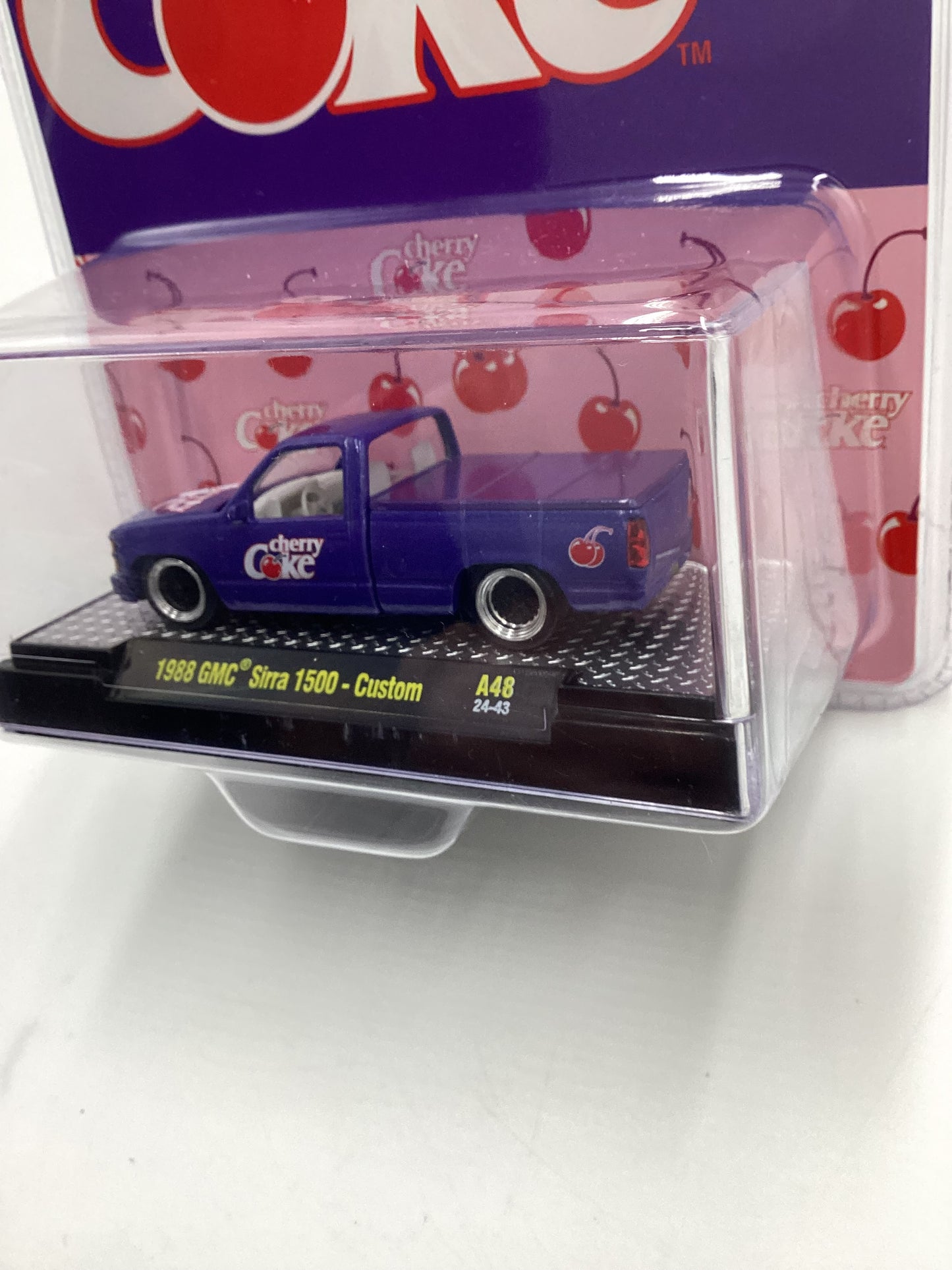 2024 M2 Machines Cherry Coke (Sirra Error) 1988 GMC Sierra 1500 Custom Purple 205E