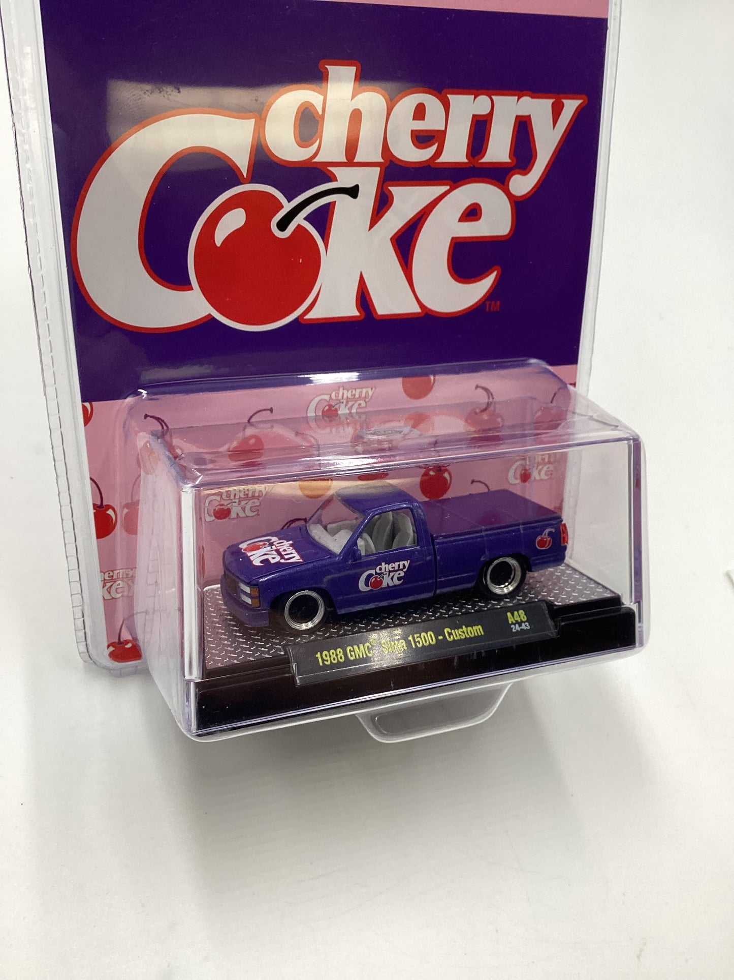 2024 M2 Machines Cherry Coke (Sirra Error) 1988 GMC Sierra 1500 Custom Purple 205E