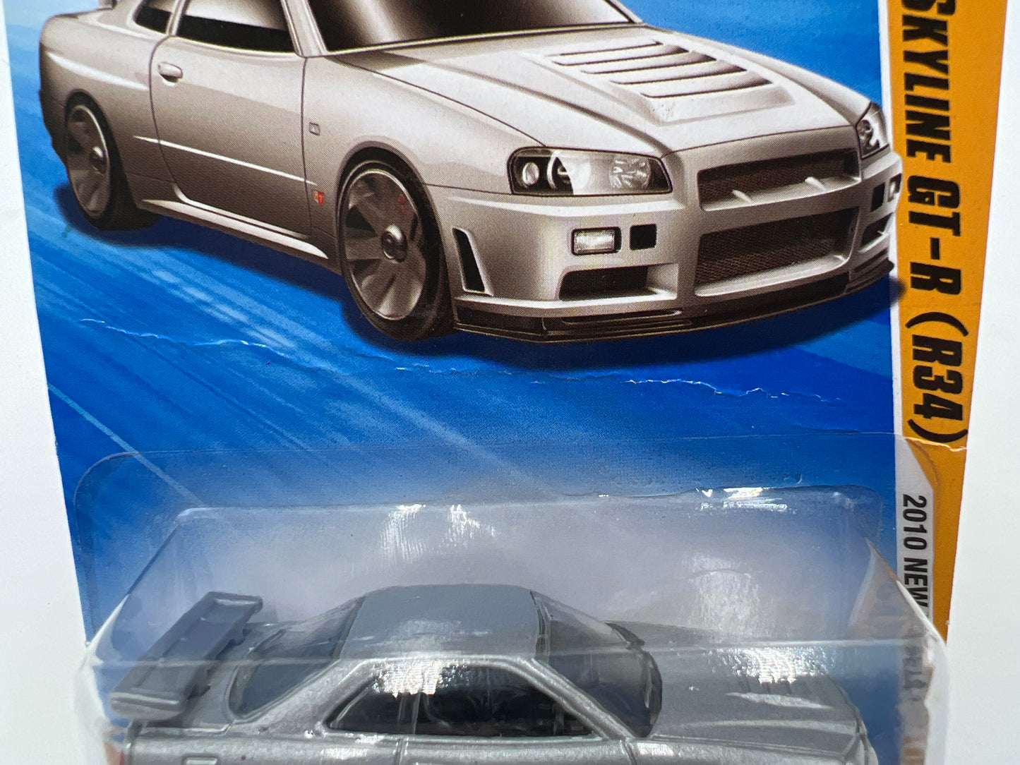 2010 Hot Wheels New Models #007 Nissan Skyline GT-R R34 Silver HTF W/Protector *Bad Card*