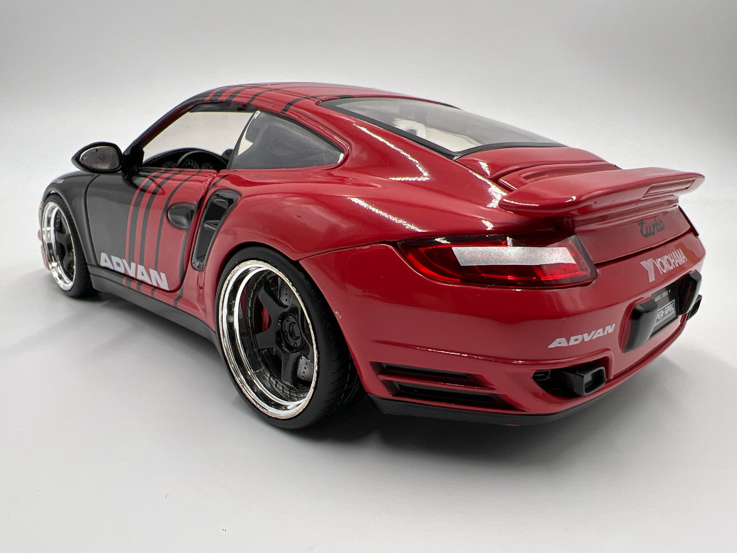 Jada Toys 1/24 Scale Advan 2007 Porsche 911 Turbo Black/Red Loose