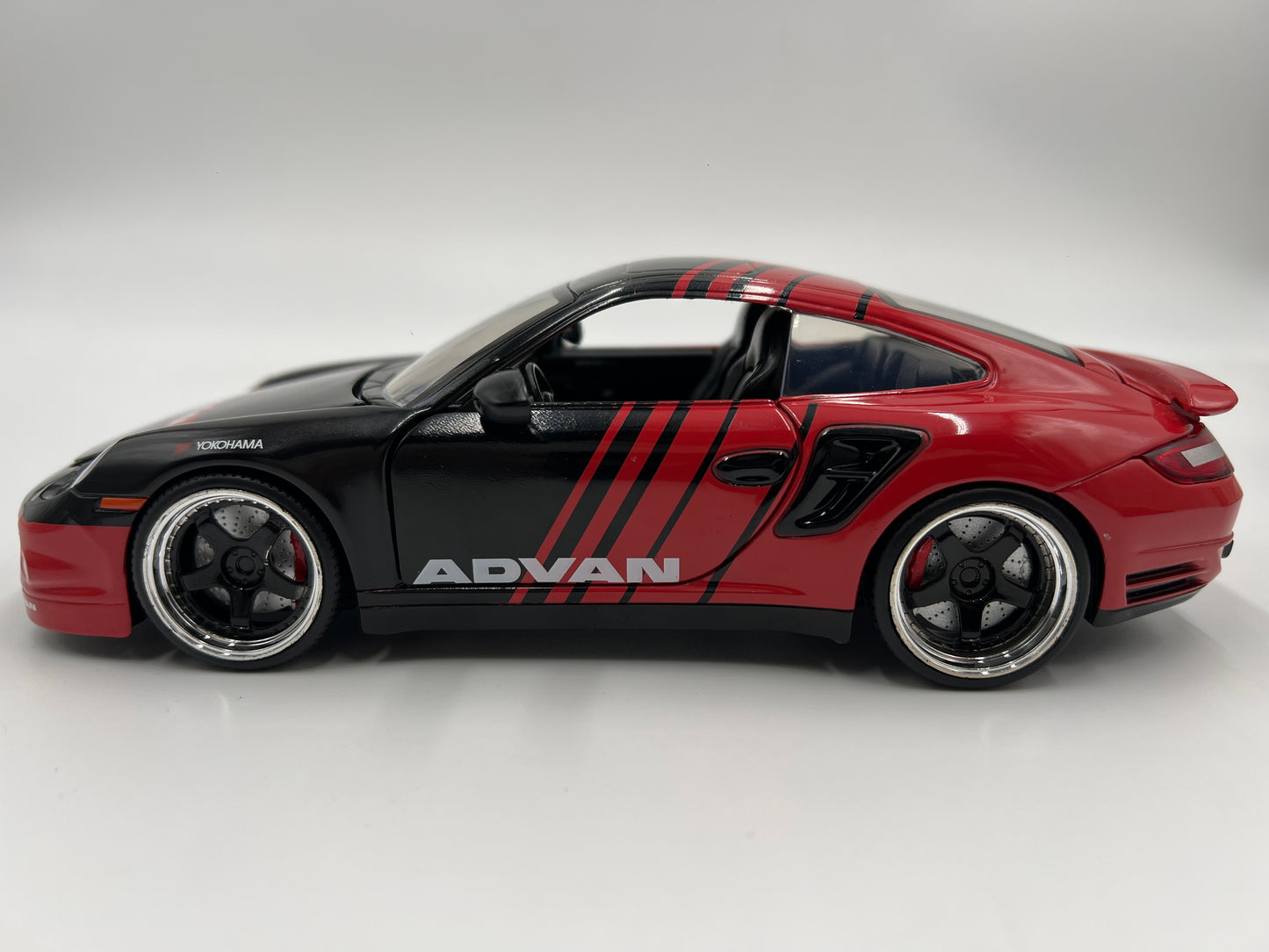 Jada Toys 1/24 Scale Advan 2007 Porsche 911 Turbo Black/Red Loose