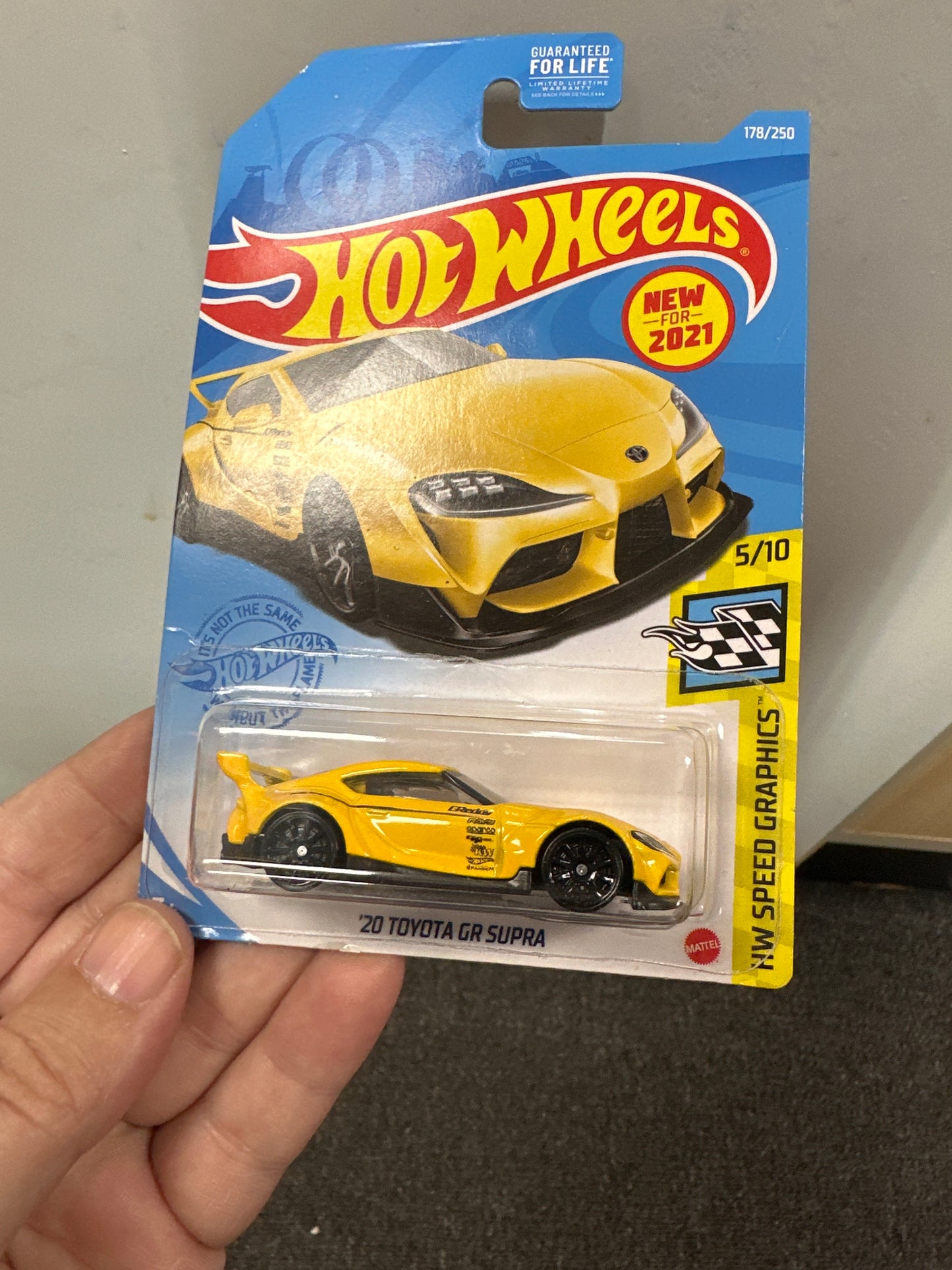 2021 hot wheels #178 20 Toyota GR Supra yellow slight bend in card 95B