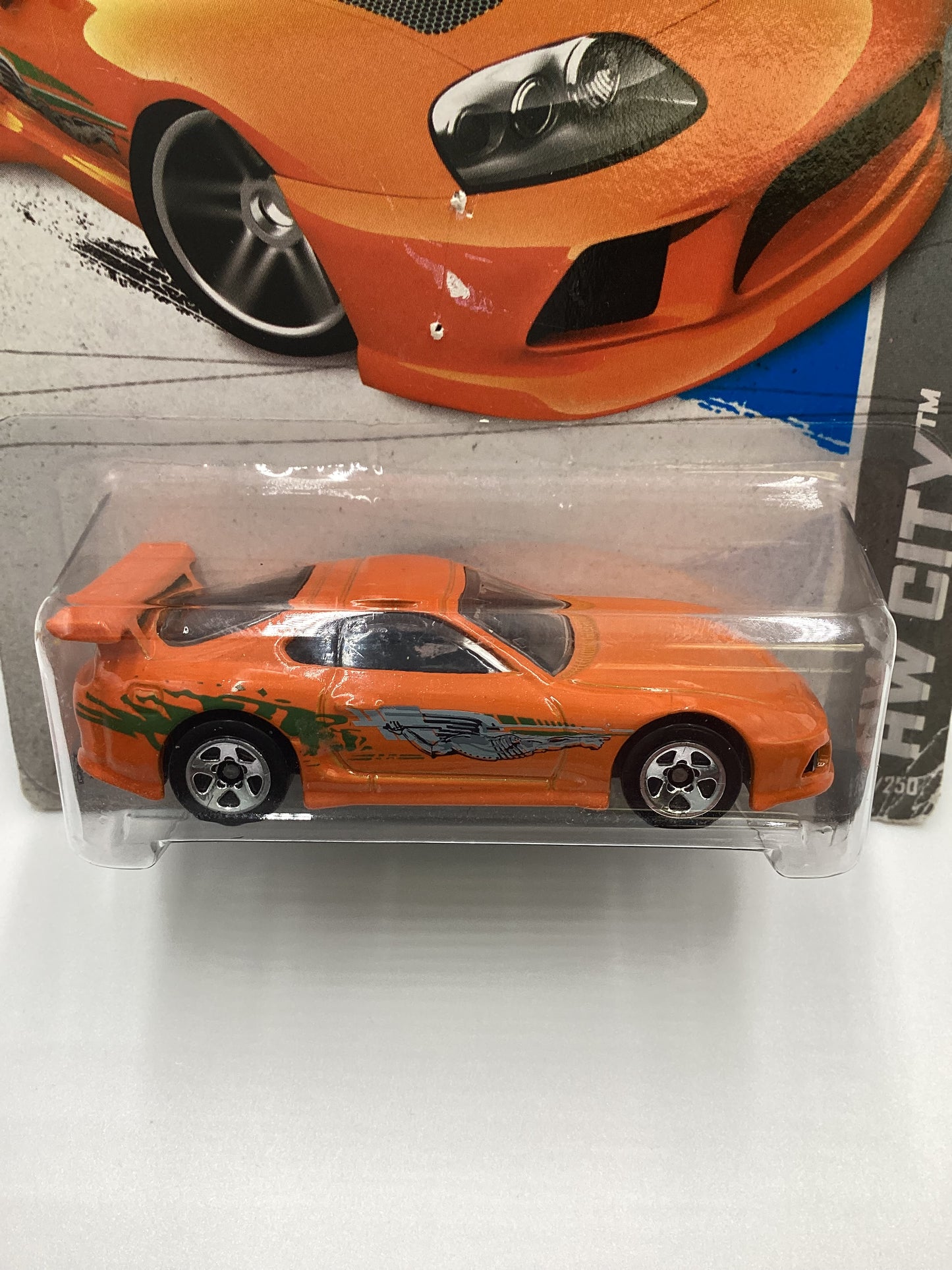 2013 Hot Wheels Fast and furious #5 Toyota Supra Orange with protector Card not perfect