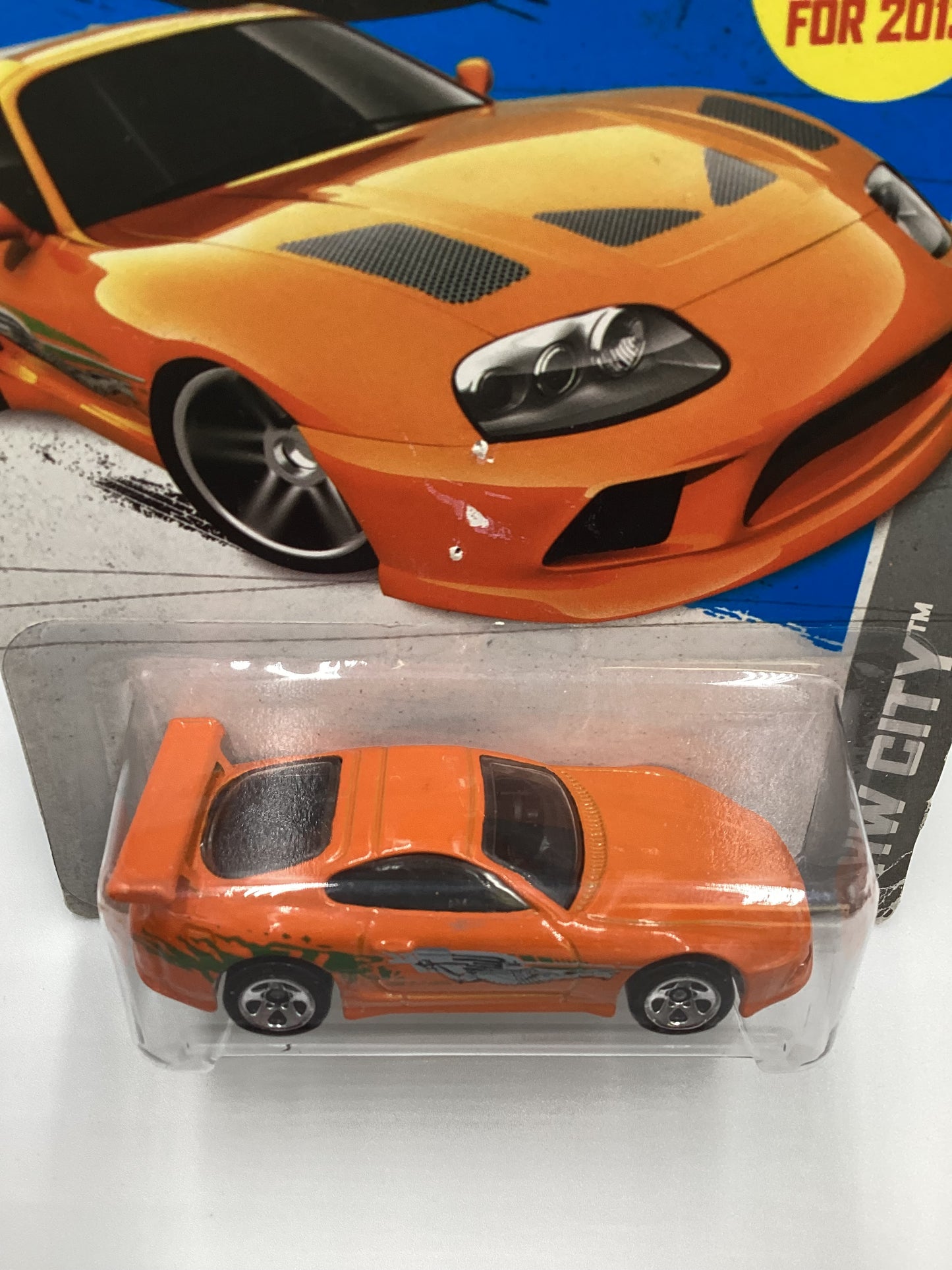 2013 Hot Wheels Fast and furious #5 Toyota Supra Orange with protector Card not perfect