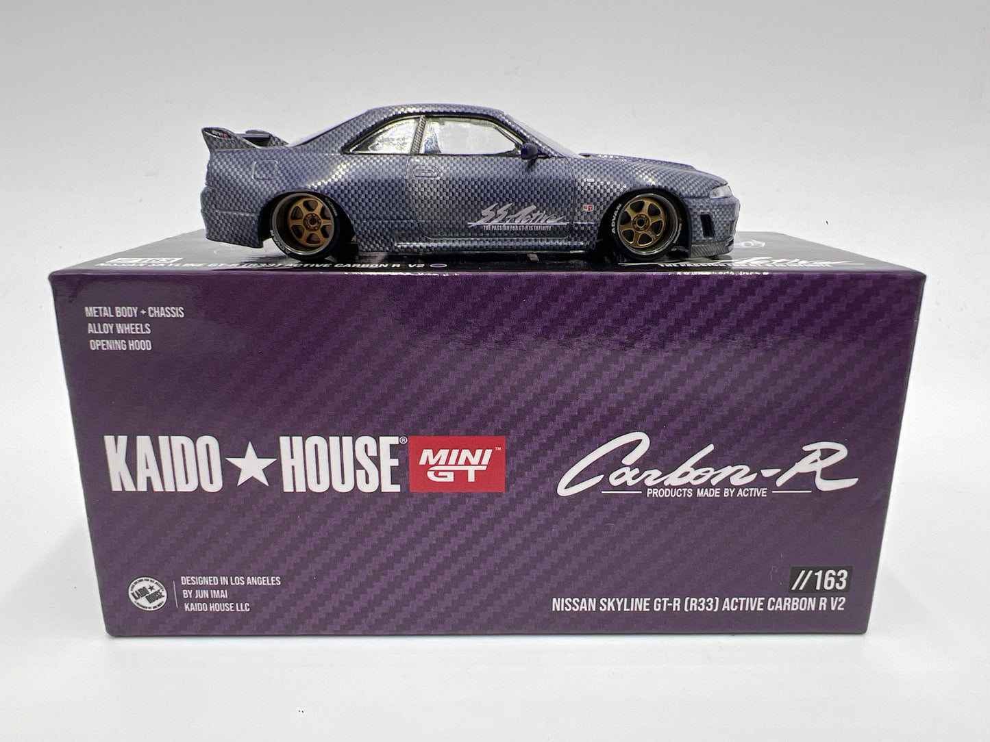 Mini GT x Kaido House #163 CHASE Nissan Skyline GT-R R33 Active Carbon R V2