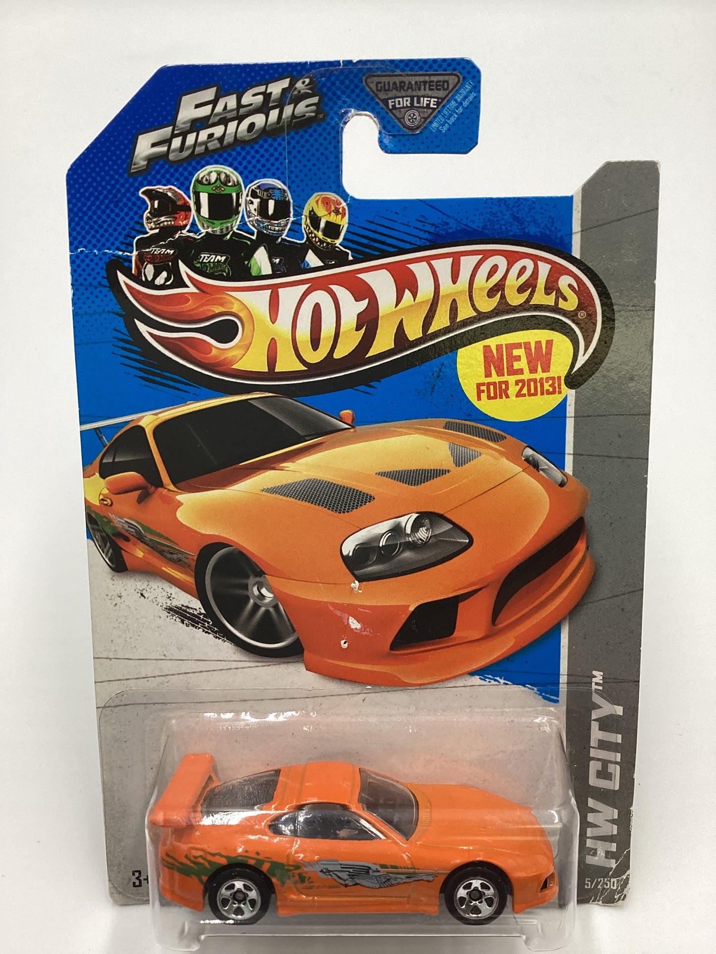 2013 Hot Wheels Fast and furious #5 Toyota Supra Orange with protector Card not perfect