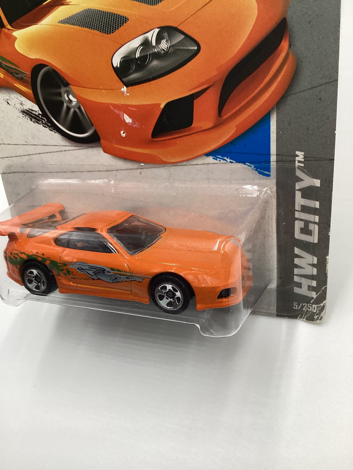 2013 Hot Wheels Fast and furious #5 Toyota Supra Orange with protector Card not perfect