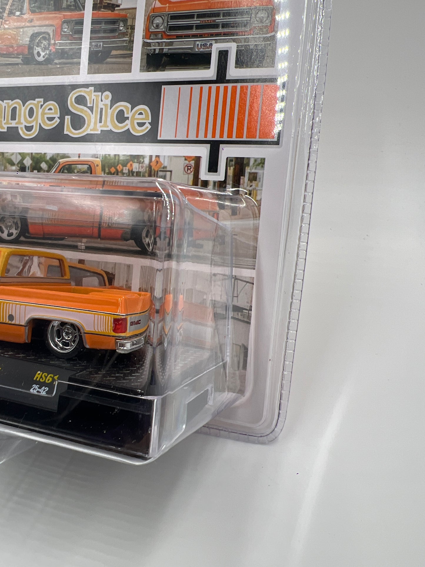 M2 Machines Hobby Exclusive Orange Slice 1976 GMC Sierra Grande 15 HS61 201D