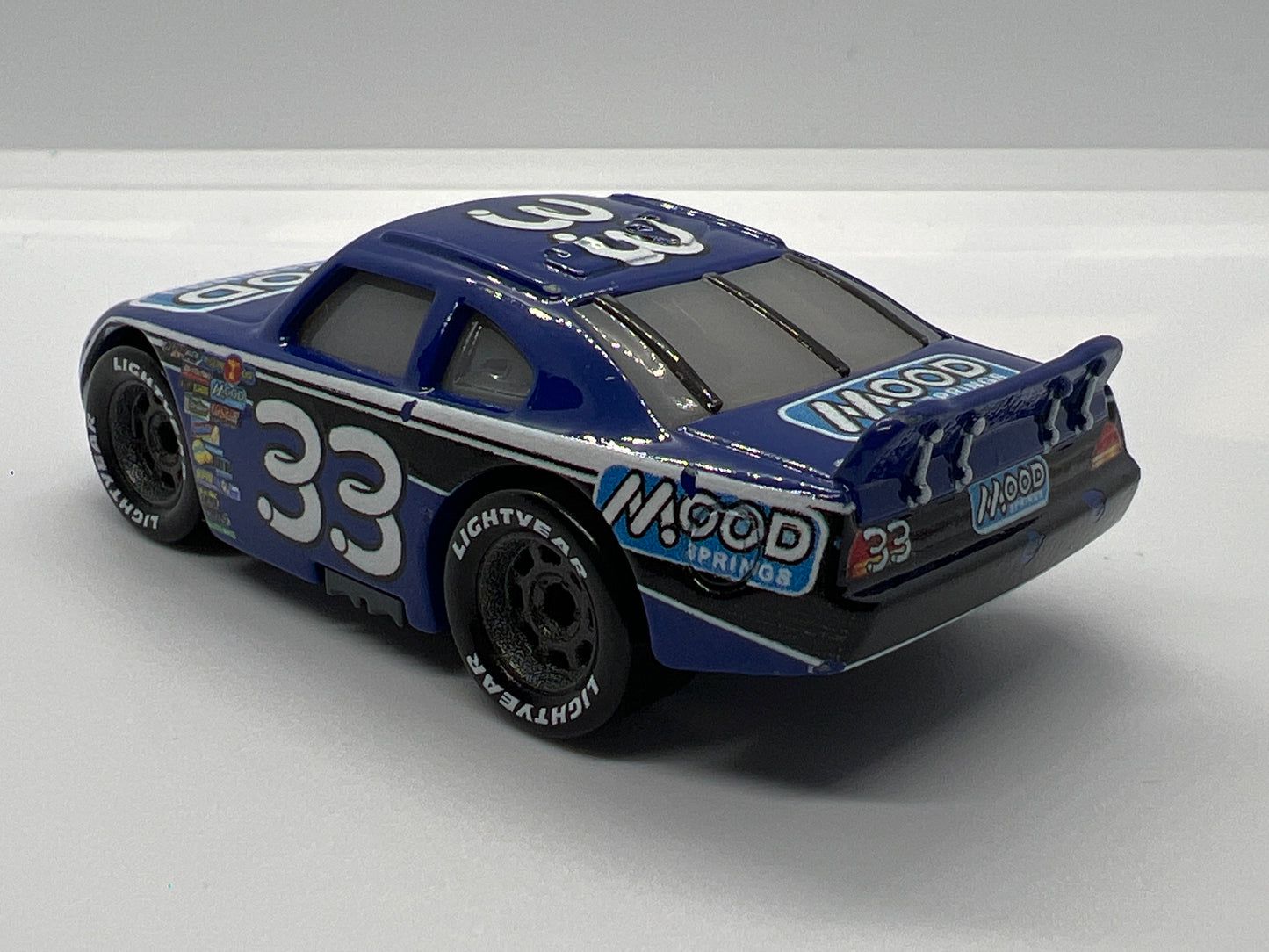 Disney Pixar Cars Dinoco 400 #33 Dud Throttleman Mood Springs Blue Loose