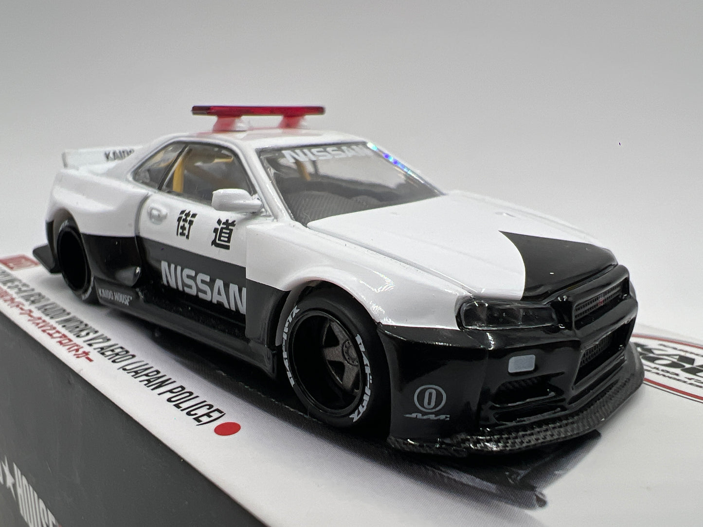 Mini GT x Kaido House #120 Nissan Skyline GT-R R34 Kaido Works V2 Aero Japan Police