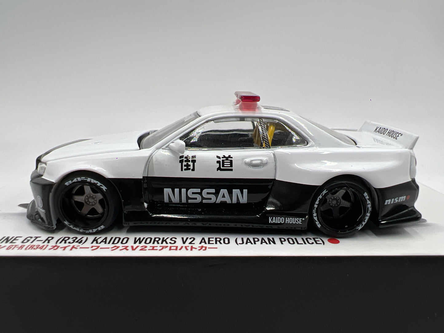 Mini GT x Kaido House #120 Nissan Skyline GT-R R34 Kaido Works V2 Aero Japan Police