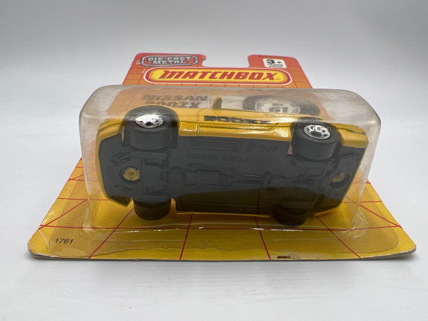 1990 Matchbox Motors MB #61 300ZX Yellow W/Protector Bad Card SR