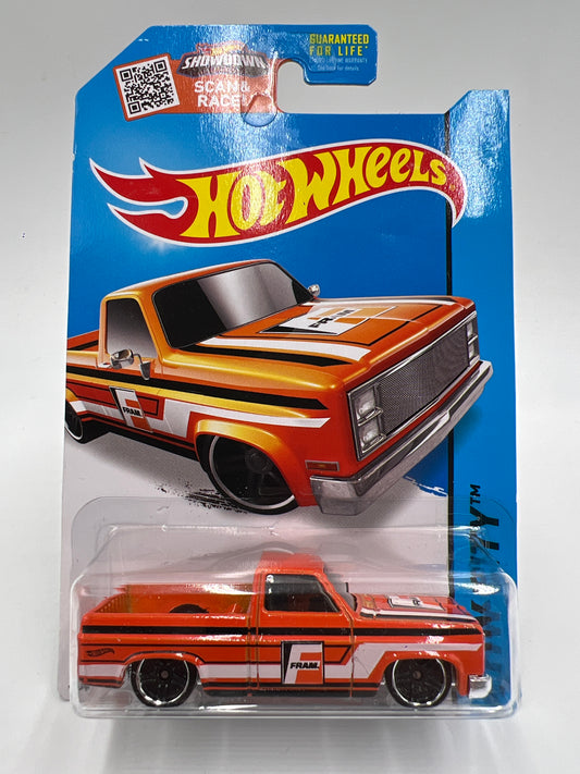 2015 Hot Wheels City #16 83 Chevy Silverado Fram Orange W/Protector 1