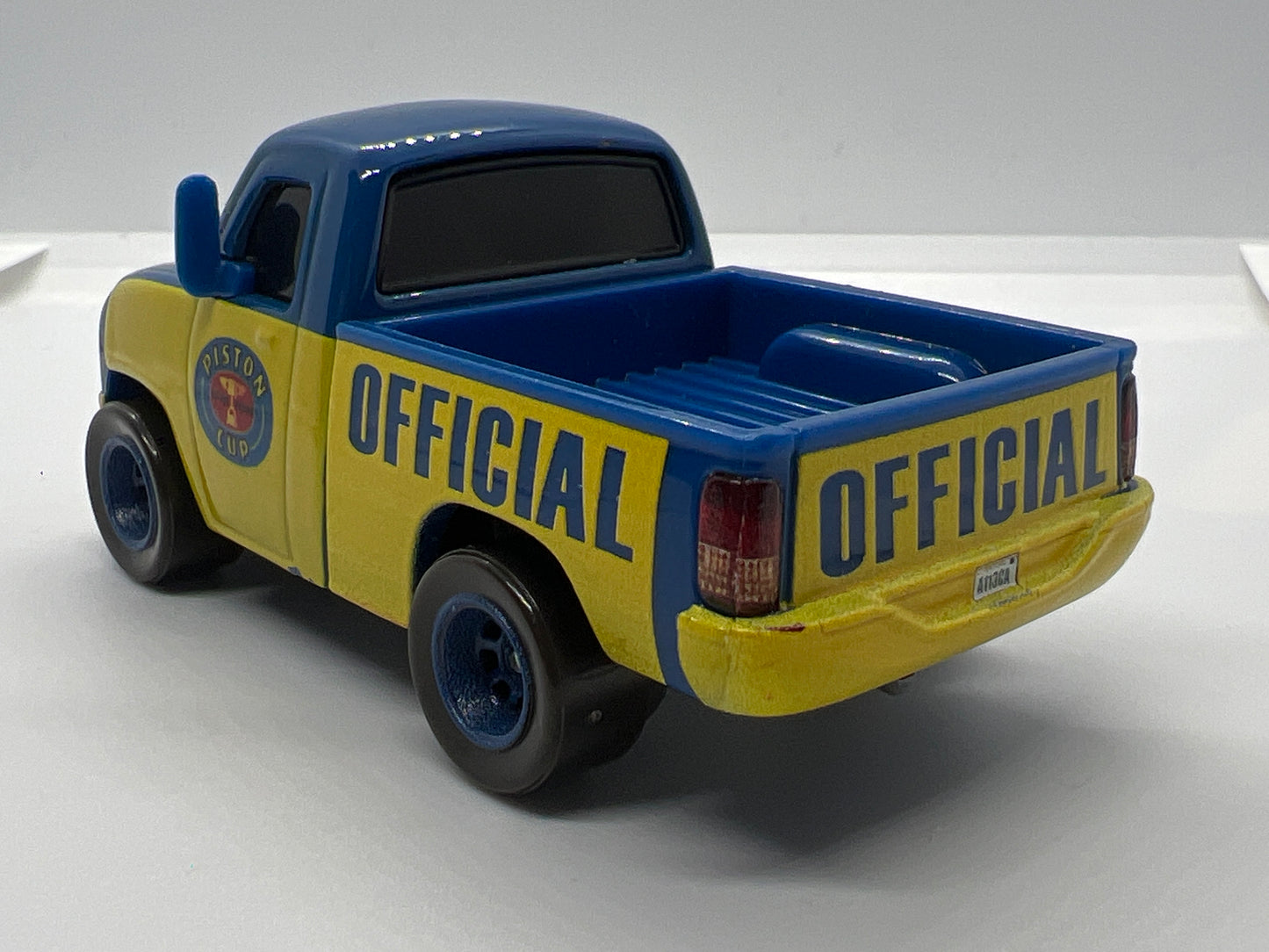 Disney Pixar Cars Piston Cup Race Tom Truck Blue/Yellow Loose