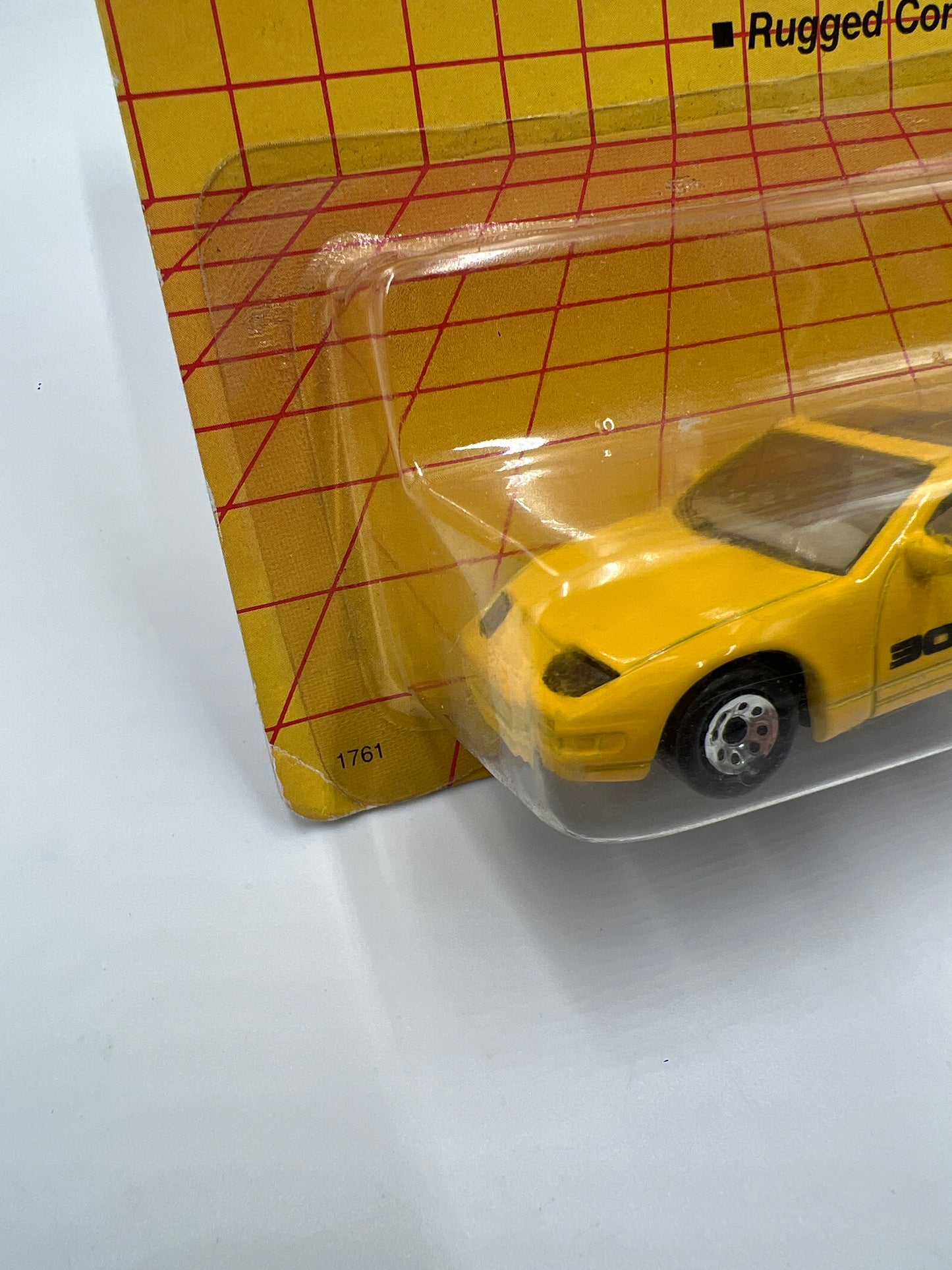 1990 Matchbox Motors MB #61 300ZX Yellow W/Protector Bad Card SR