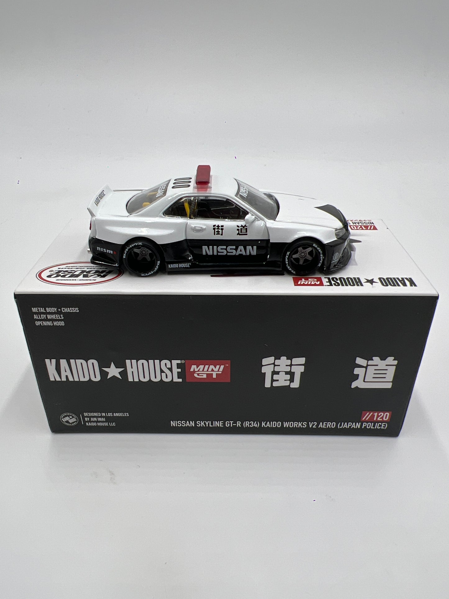 Mini GT x Kaido House #120 Nissan Skyline GT-R R34 Kaido Works V2 Aero Japan Police