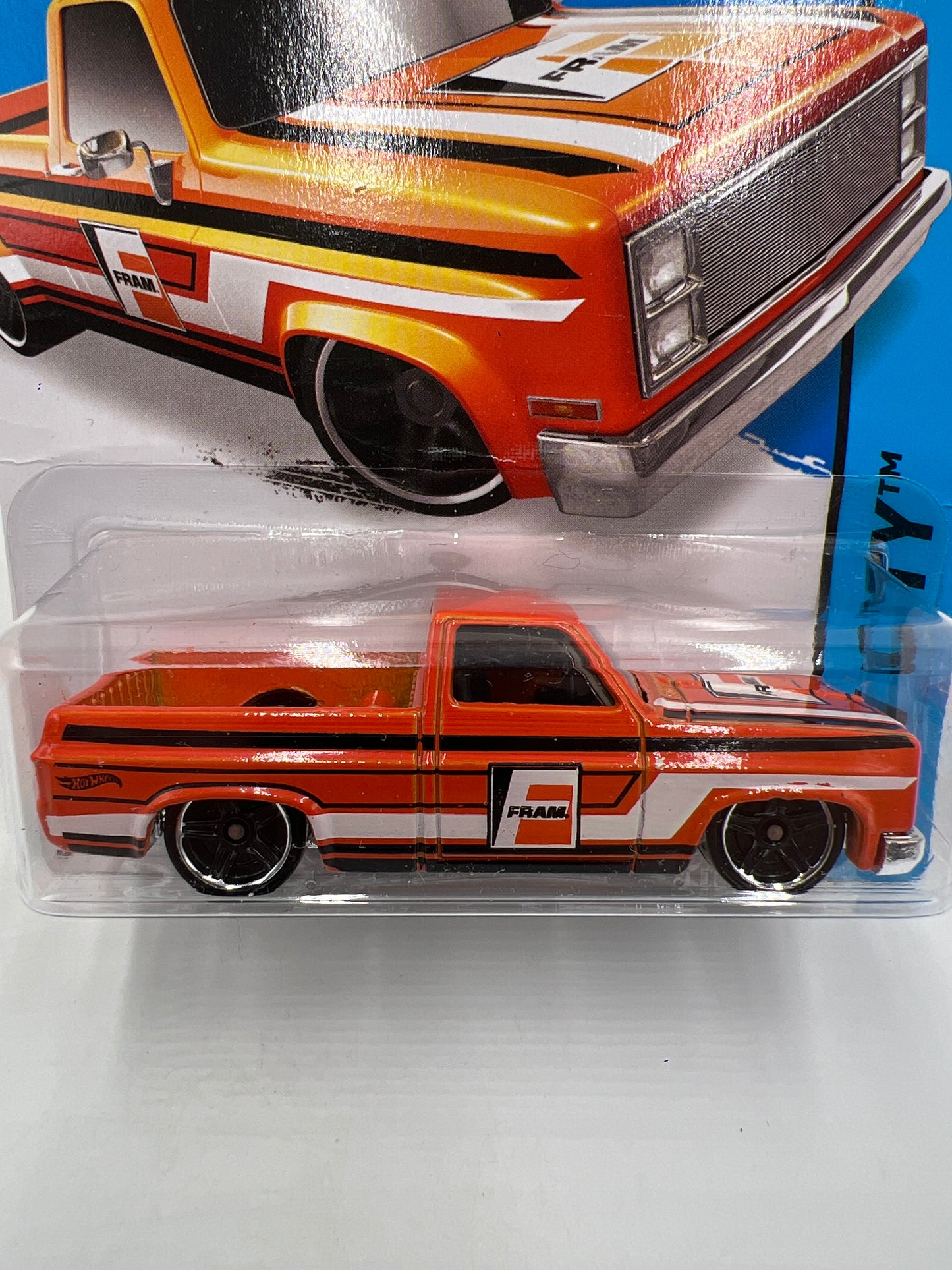 2015 Hot Wheels City #16 83 Chevy Silverado Fram Orange W/Protector Bad Card