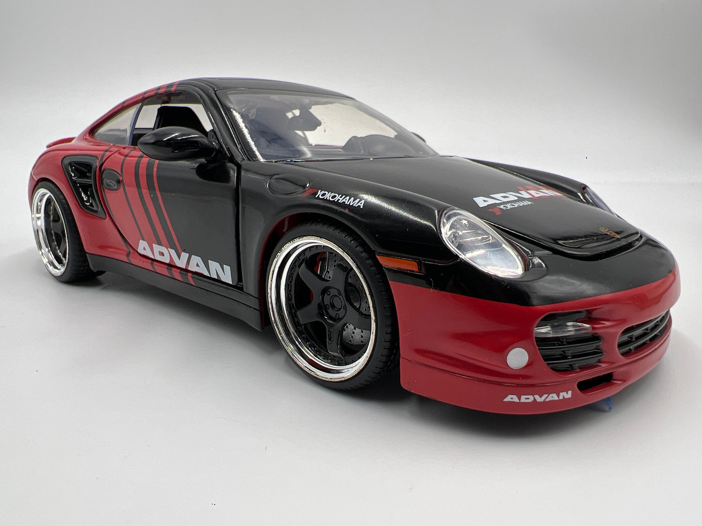 Jada Toys 1/24 Scale Advan 2007 Porsche 911 Turbo Black/Red Loose