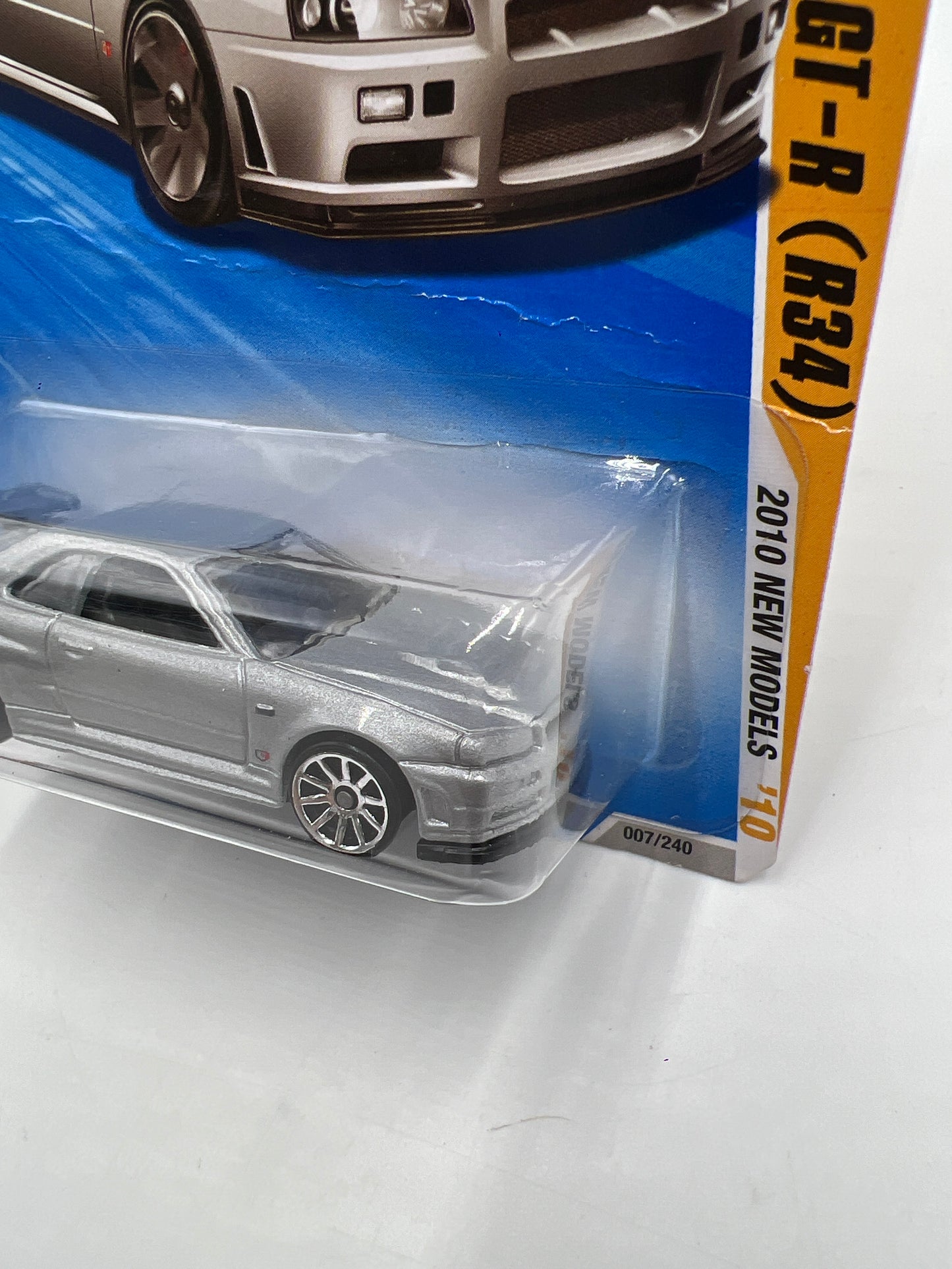 2010 Hot Wheels New Models #007 Nissan Skyline GT-R R34 Silver HTF W/Protector *Bad Card*