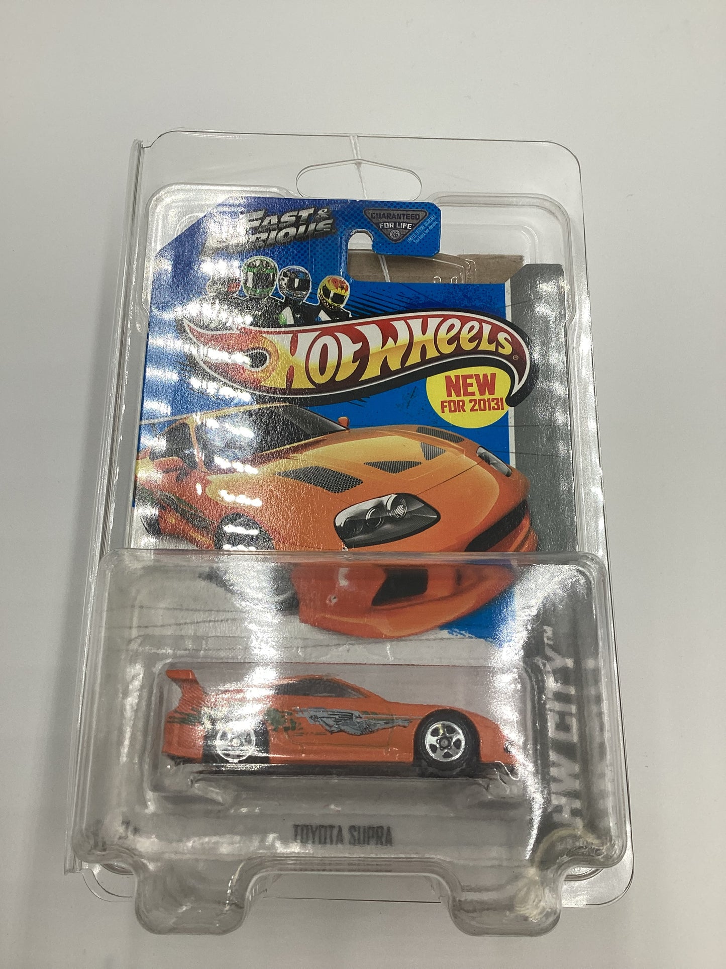 2013 Hot Wheels Fast and furious #5 Toyota Supra Orange with protector Card not perfect