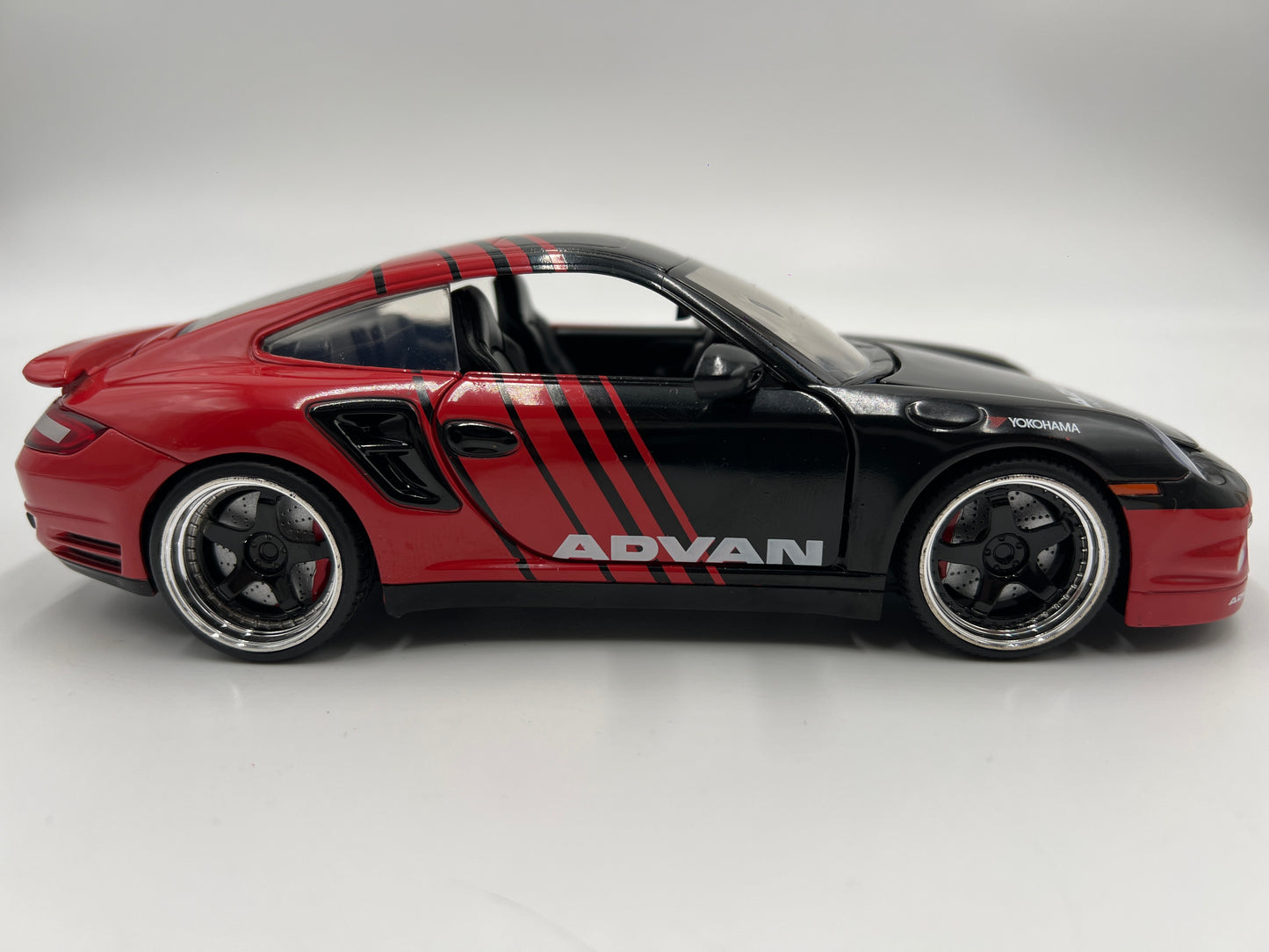 Jada Toys 1/24 Scale Advan 2007 Porsche 911 Turbo Black/Red Loose