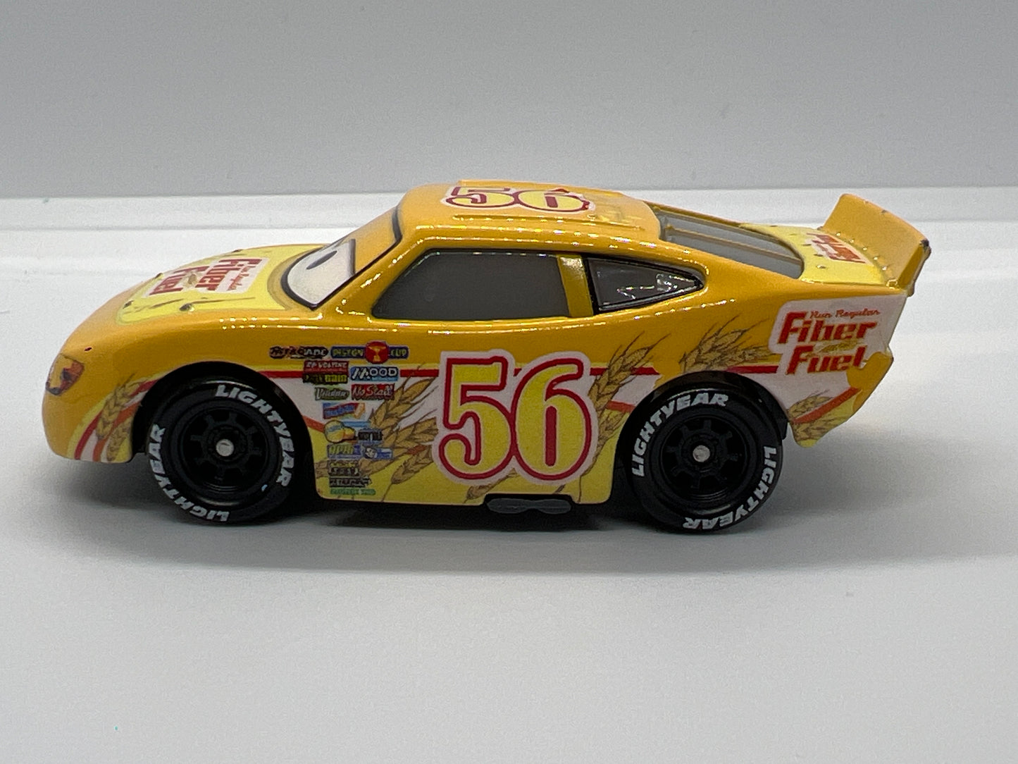 Disney Pixar Cars #42 Brusho Curber Fiber Fuel Yellow Loose