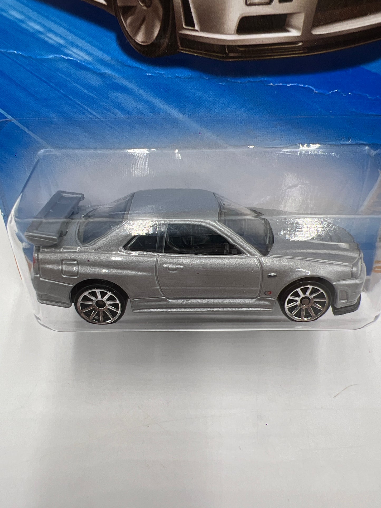 2010 Hot Wheels New Models #007 Nissan Skyline GT-R R34 Silver HTF W/Protector *Bad Card*